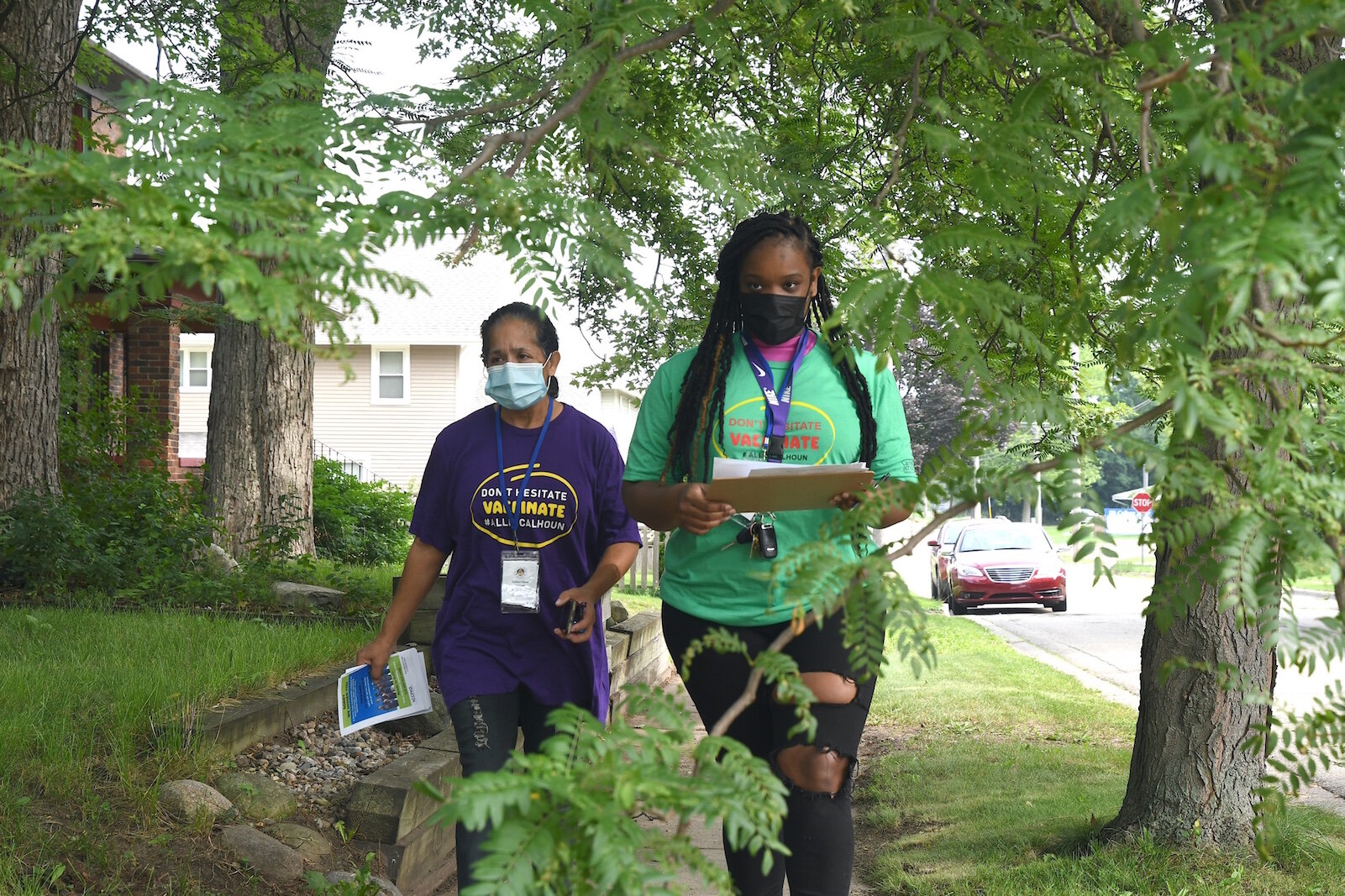 COVID Vaccine Ambassadors, from left, Brittany Johnson and Lydia Campbell head out to a neighborhood from Washington Heights United Methodist Church. 