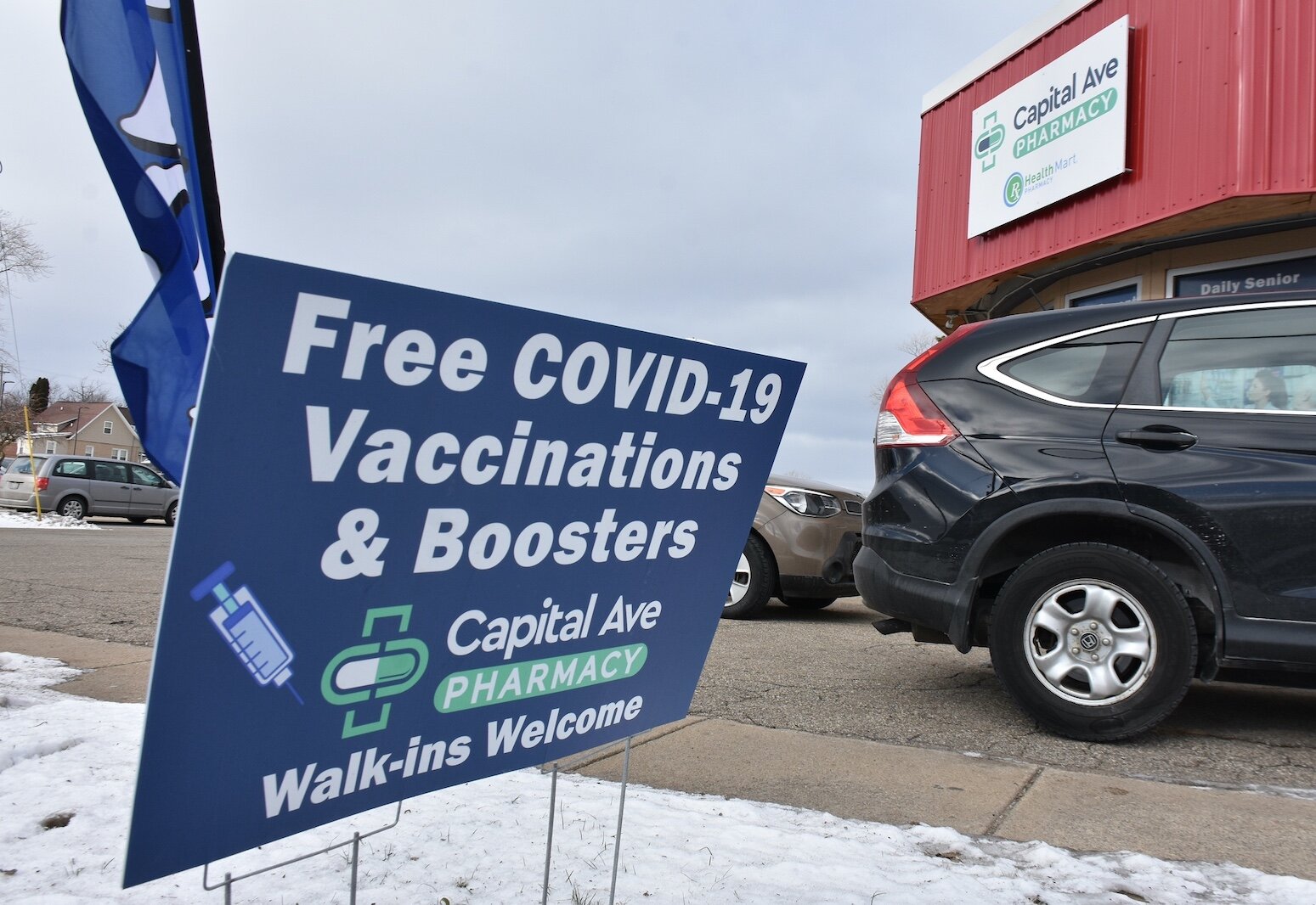 A sign outside the Capital Avenue Pharmacy, at the northeast corner of Capital Avenue Southwest and Territoriai Road, advertises free COVID shots.