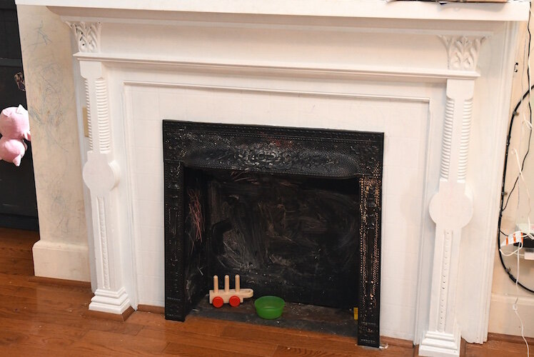 A fireplace in the Potier’s home which was repainted to during the lead abatement work.