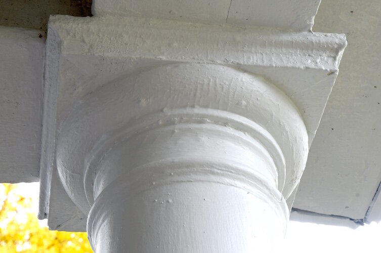 A pillar on the front porch of the Potier’s home that was recently updated and repainted during recent lead abatement work.