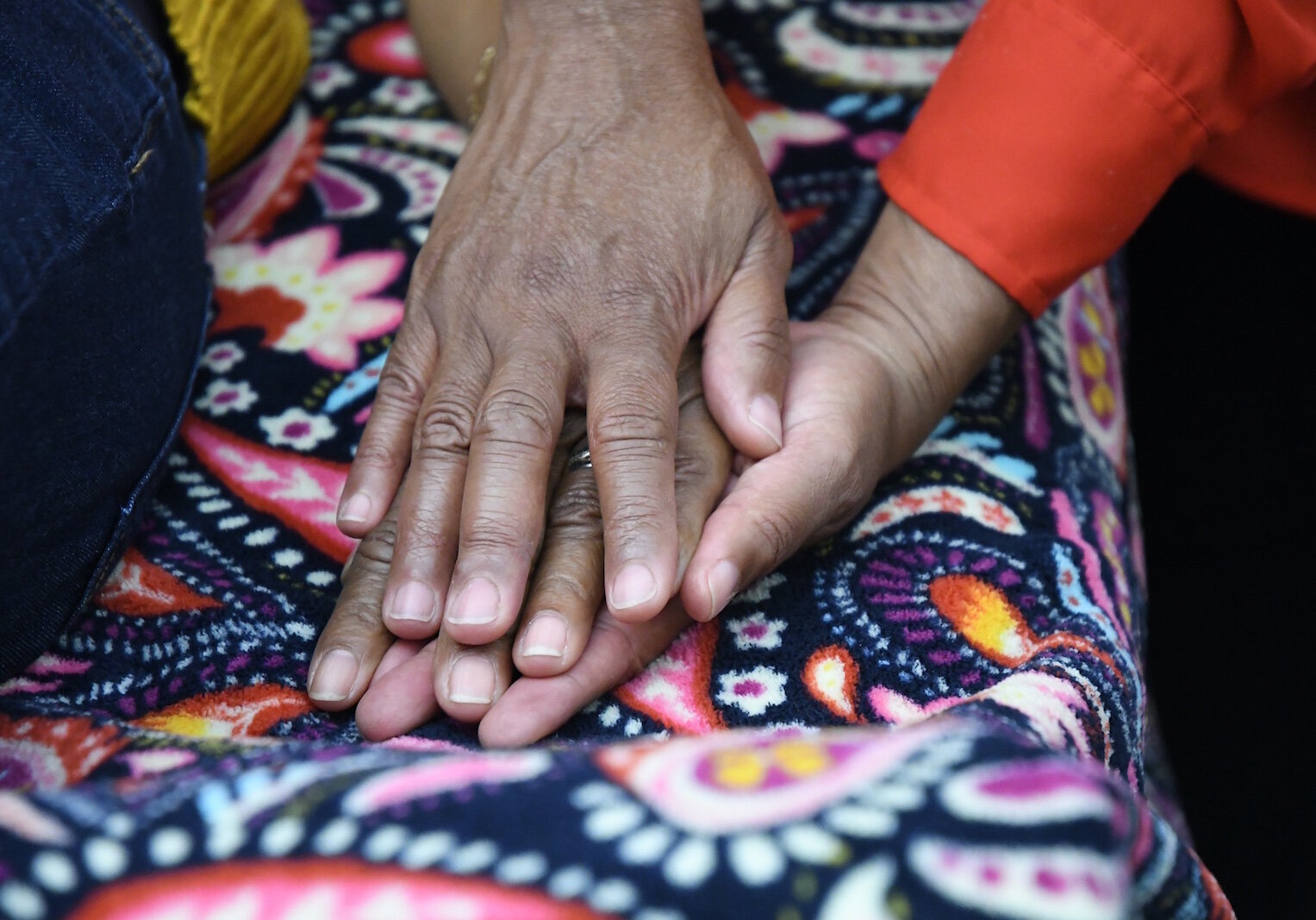 Kyle Odom provides energy healing with a client at the Restoration Center