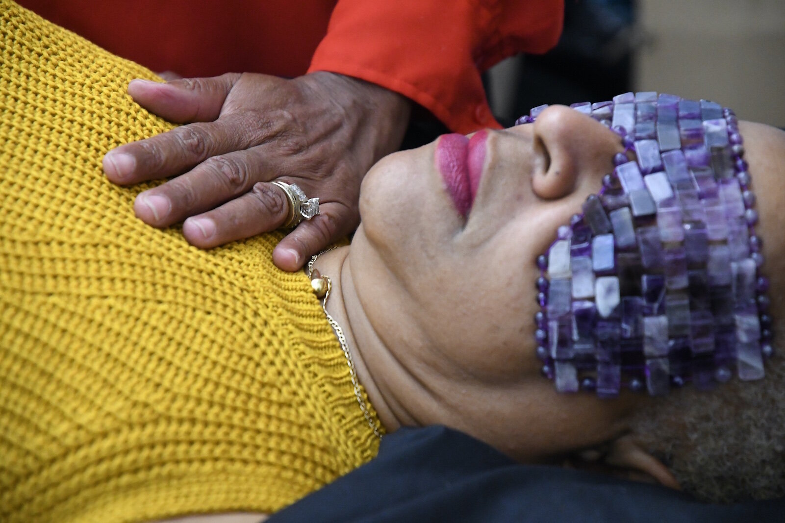 Kyle Odom provides energy healing with a client at the Restoration Center.