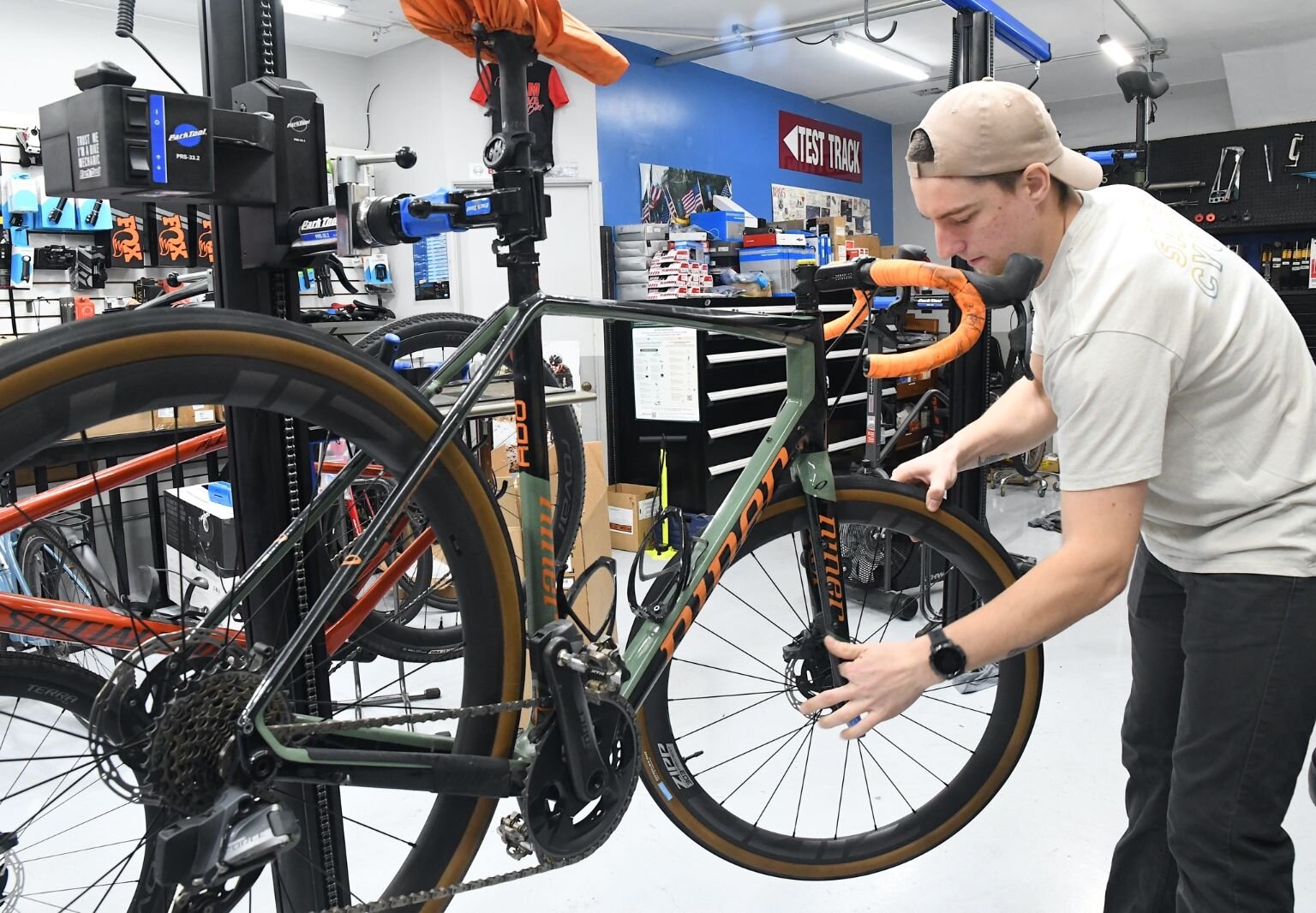 Jason Fraley works on a bike at Mike’s Team Active Bikes, 22 W. Michigan in downtown Battle Creek.