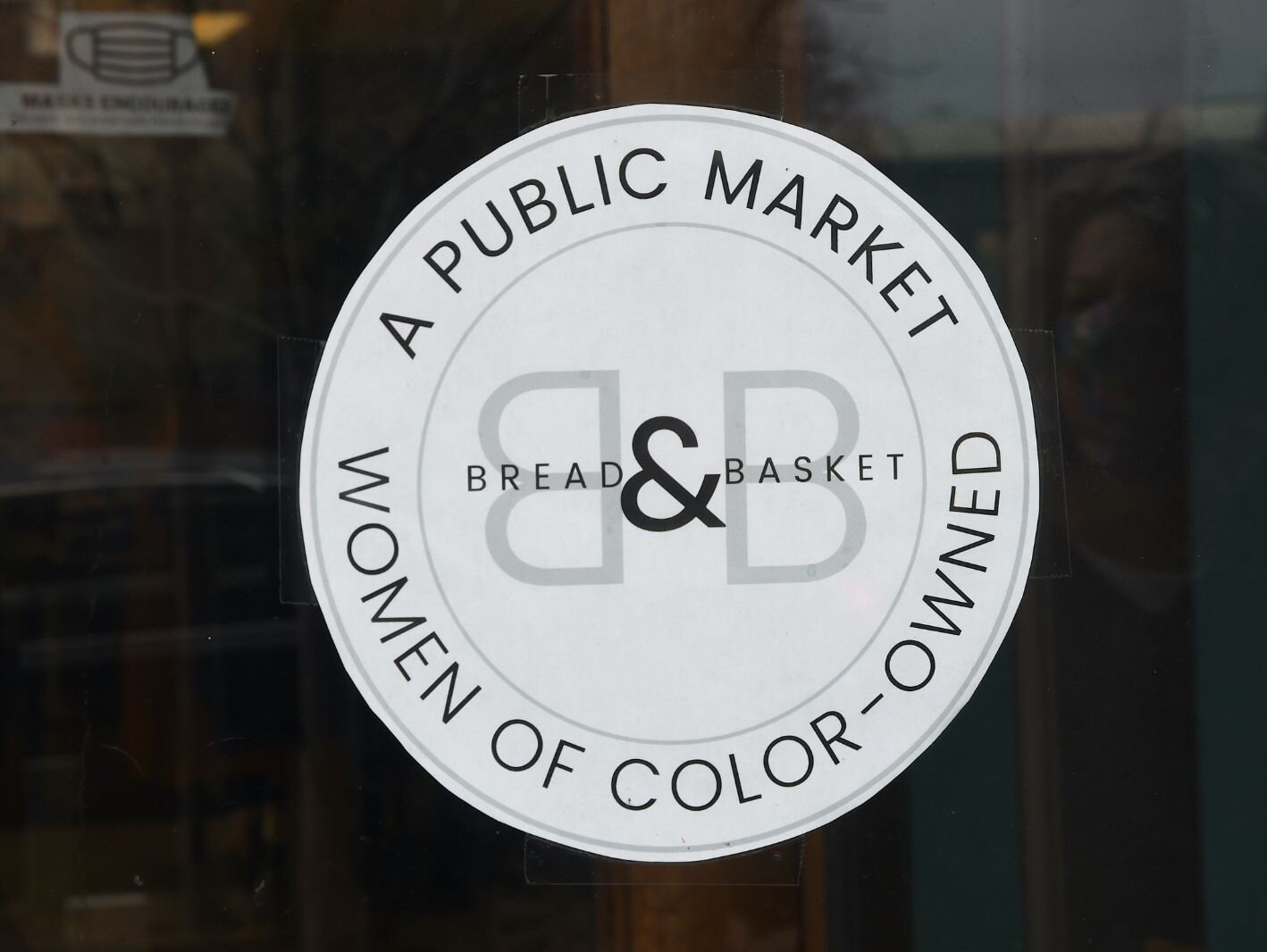 Logo on the front door Bread and Basket public market, at 38 E. Michigan in downtown Battle Creek.