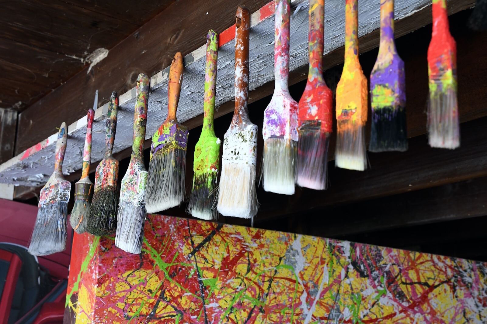Some of Andrew Freemire’s paint brushes in his garage.