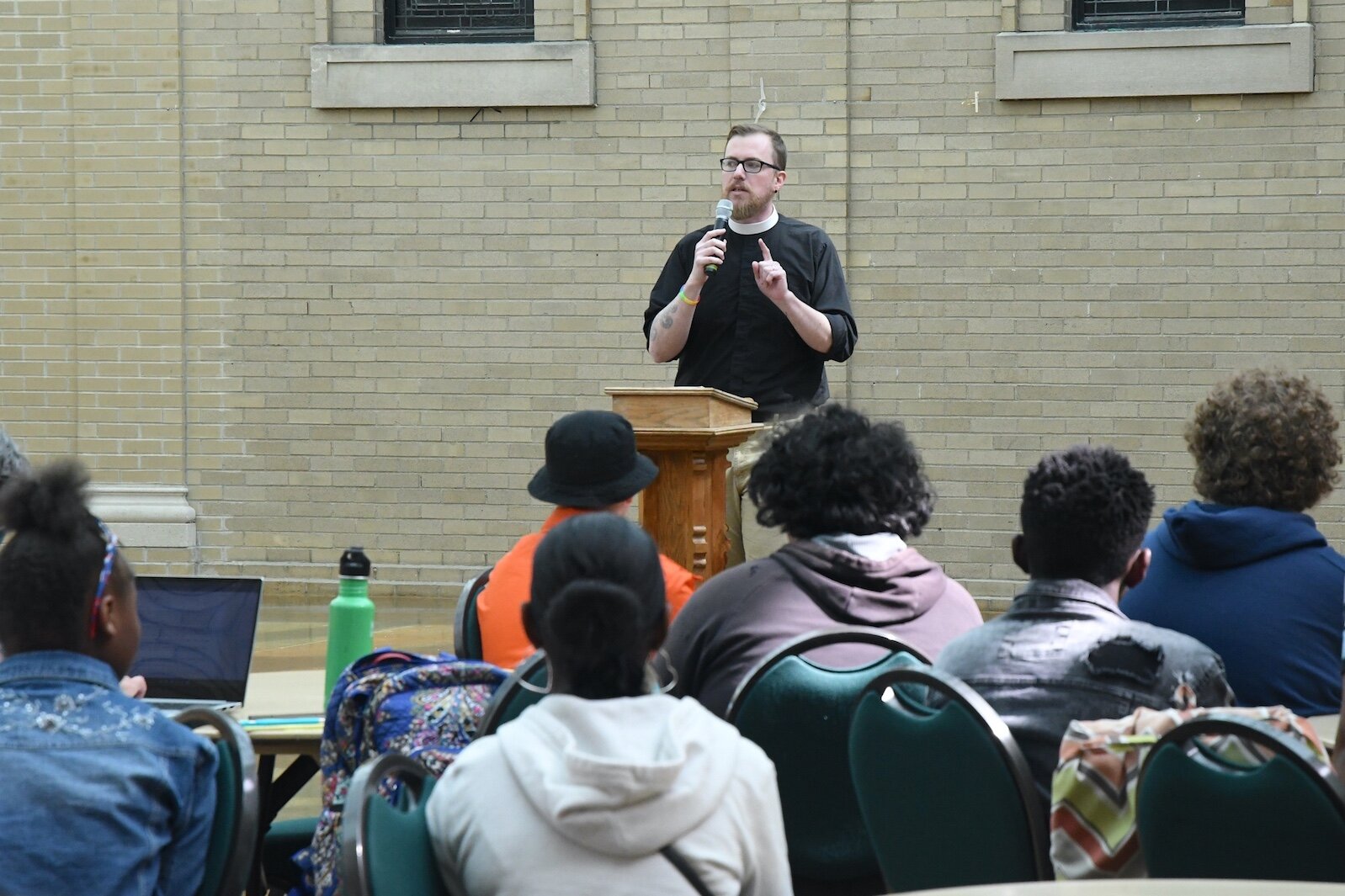 Rev. Nate Craddock, pastor at First Congregational church, speaks during an anti-gun violence rally in downtown Battle Creek.
