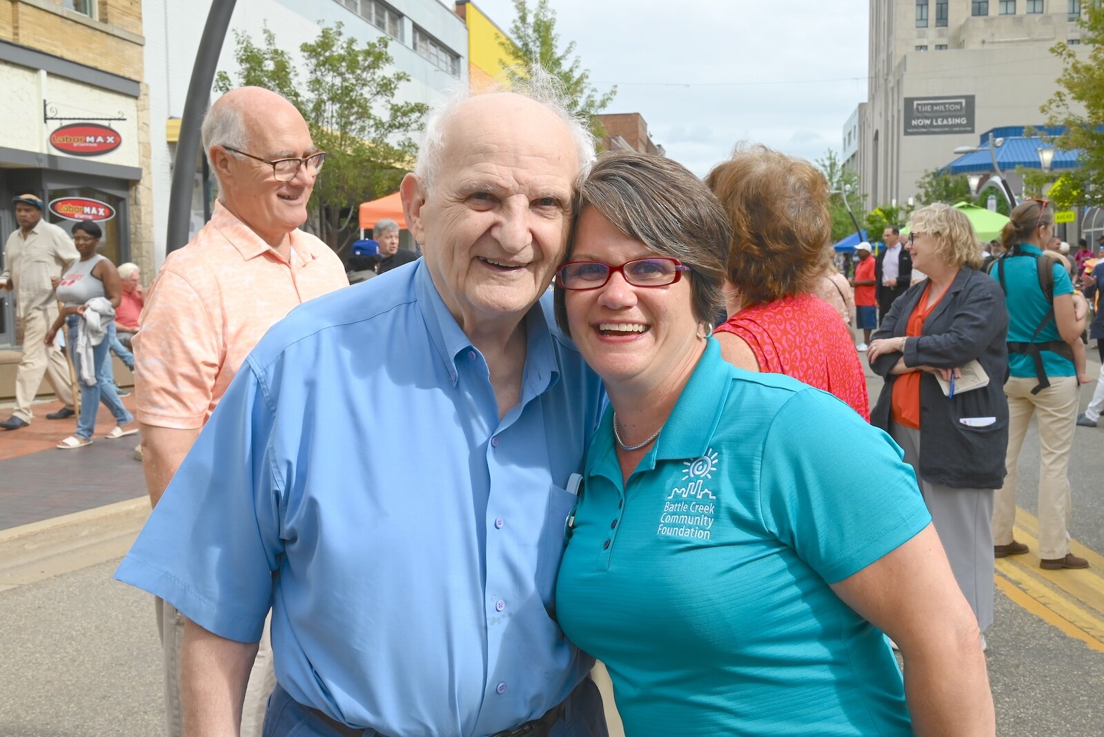 Mary Muliett, President and CEO of the Battle Creek Community Foundation, is seen with Pete Christ, one of her predecessors, at the foundation’s annual block party.