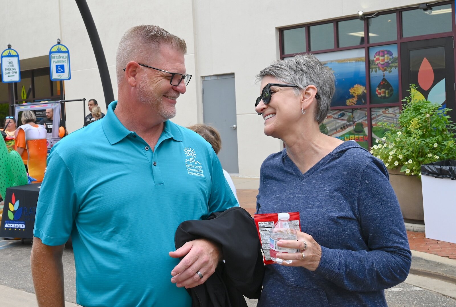 Rob Ridgeway, BCCF board president and Harper Creek School’s Superintendent, and Teresa Durham, non-profit consultant, are seen at the BCCF’s block party.