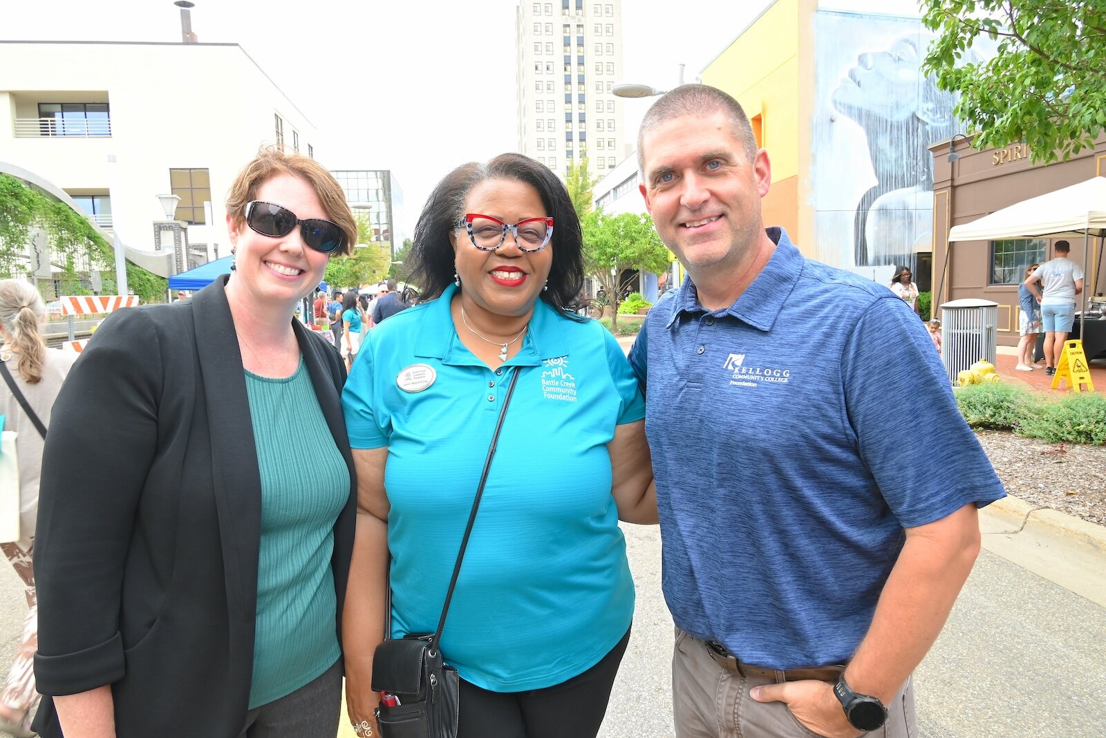 Seen at the BCCF’s block party are, from left, Michelle Williamson of the KCC Foundation, Lynn Ward Gray of the BCCF, and Eric Greene of KCC.