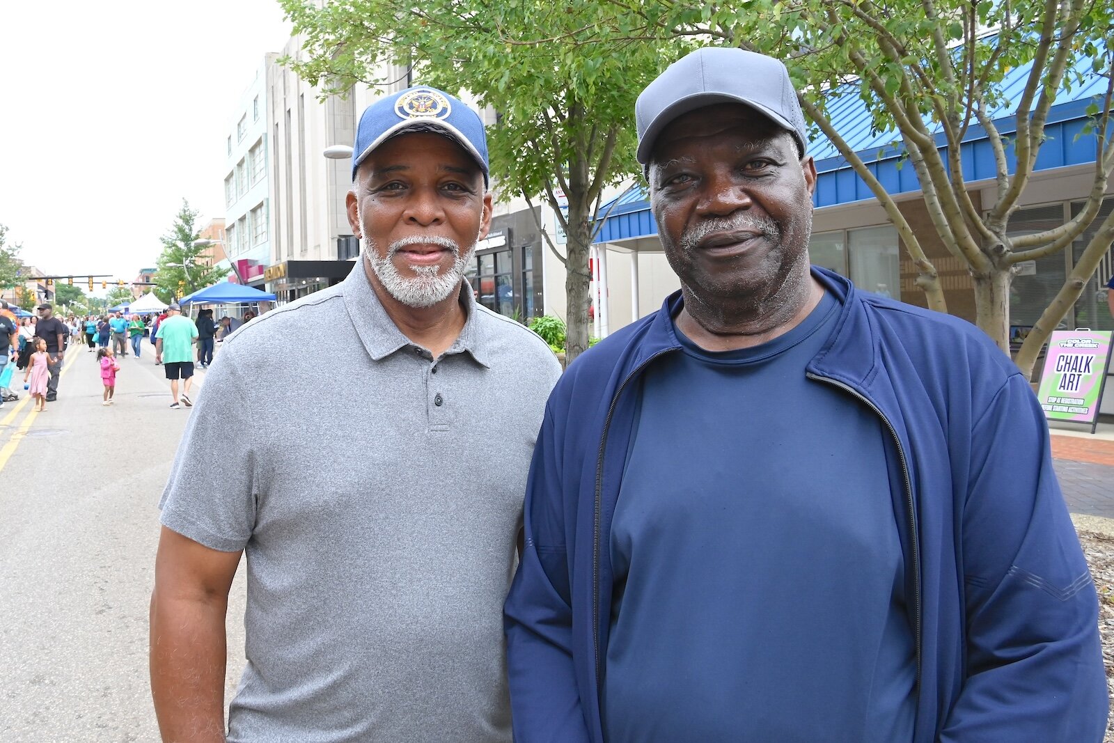 Former Battle Creek Central High School coaches and community leaders, Greg Williams, left, and Fred Jones are seen at the BCCF’s block party.