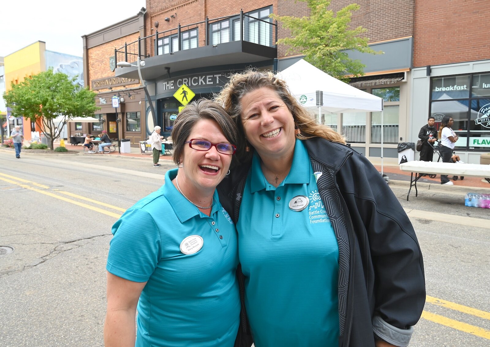 Mary Muliett, President and CEO of the Battle Creek Community Foundation (BCCF), left, and Kacie Brunner of Athens at the foundation’s annual block party.