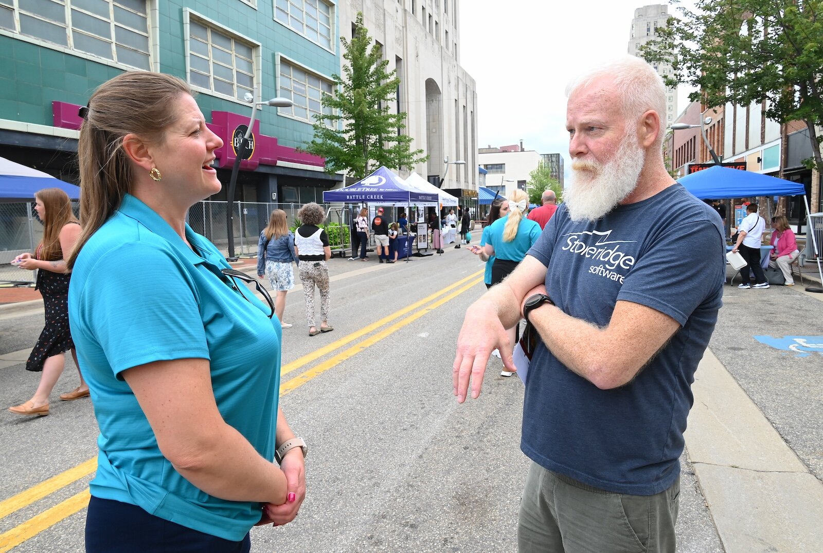 Michelle Fuller, a board member of the BCCF, and Patrick Barnett, President of the Kingman Museum board, talk at the block party.