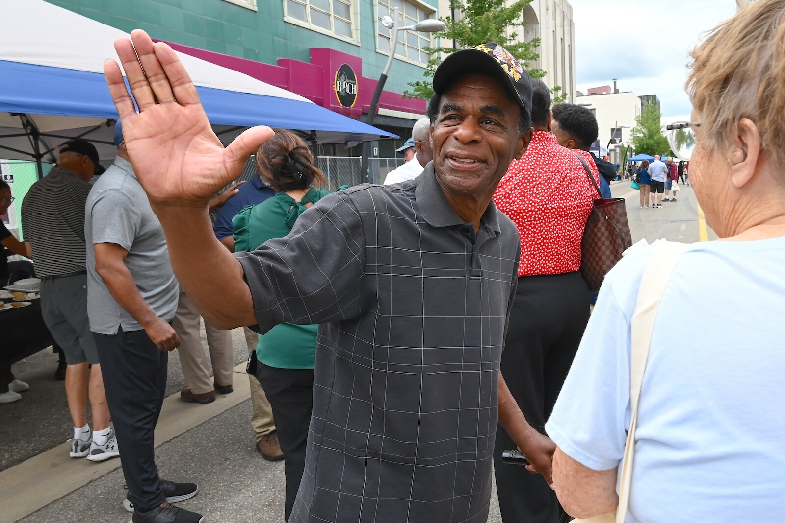 Community leader Bobby Holley waves to a friend at the BCCF’s block party.
