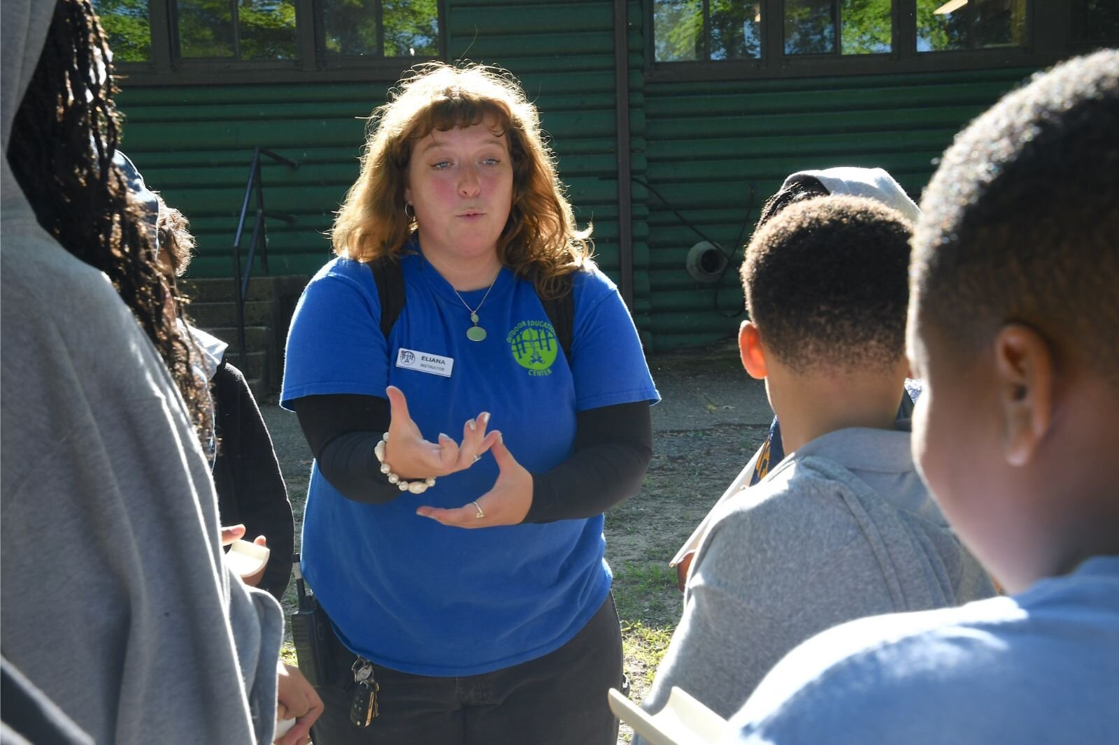 Instructor Eliana Brochu explains a team-building exercise to STEM students at the Battle Creek Outdoor Education Center.