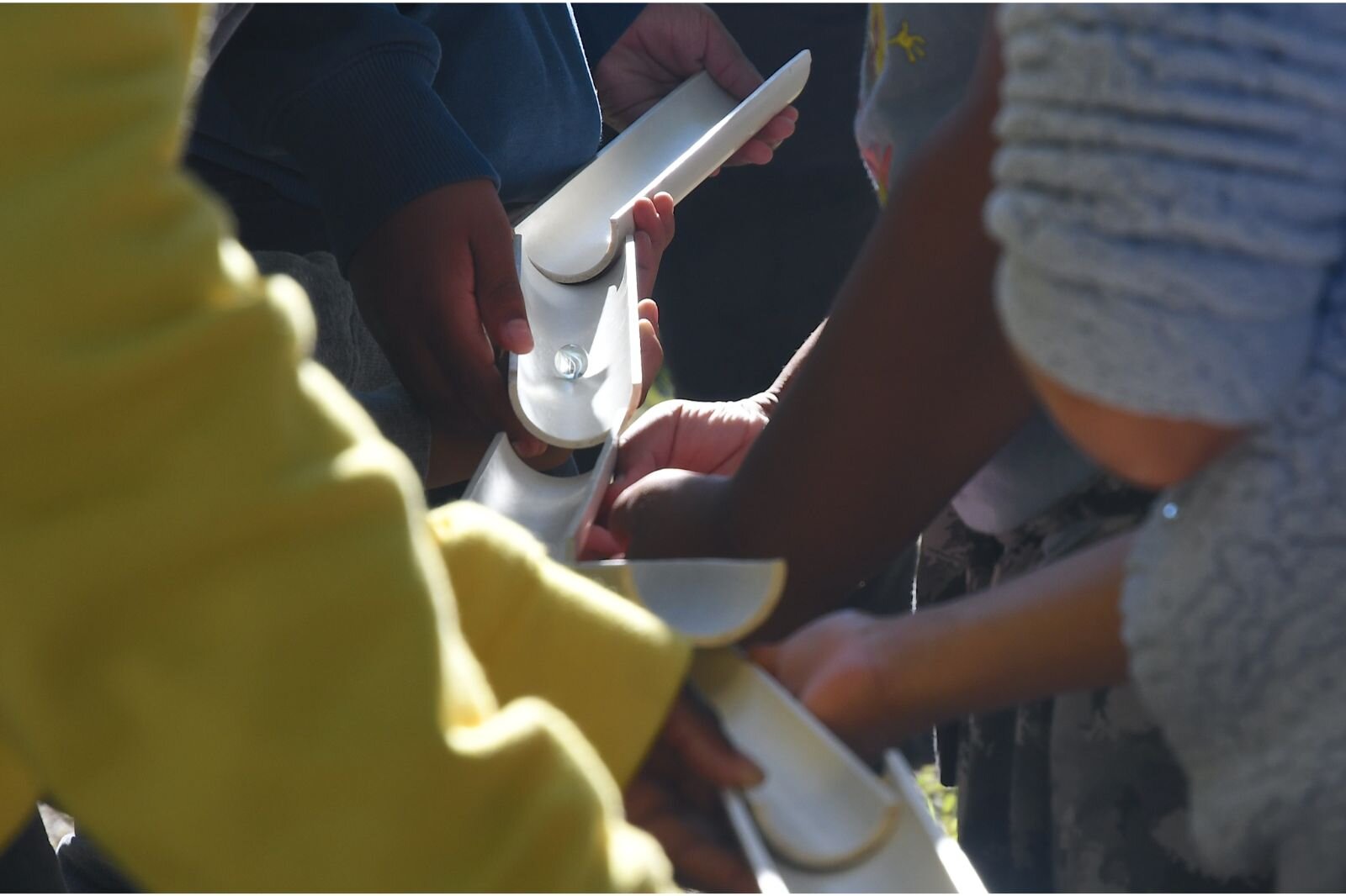 STEM students work together to help a marble move along during a team-building exercise at the Battle Creek Outdoor Education Center.