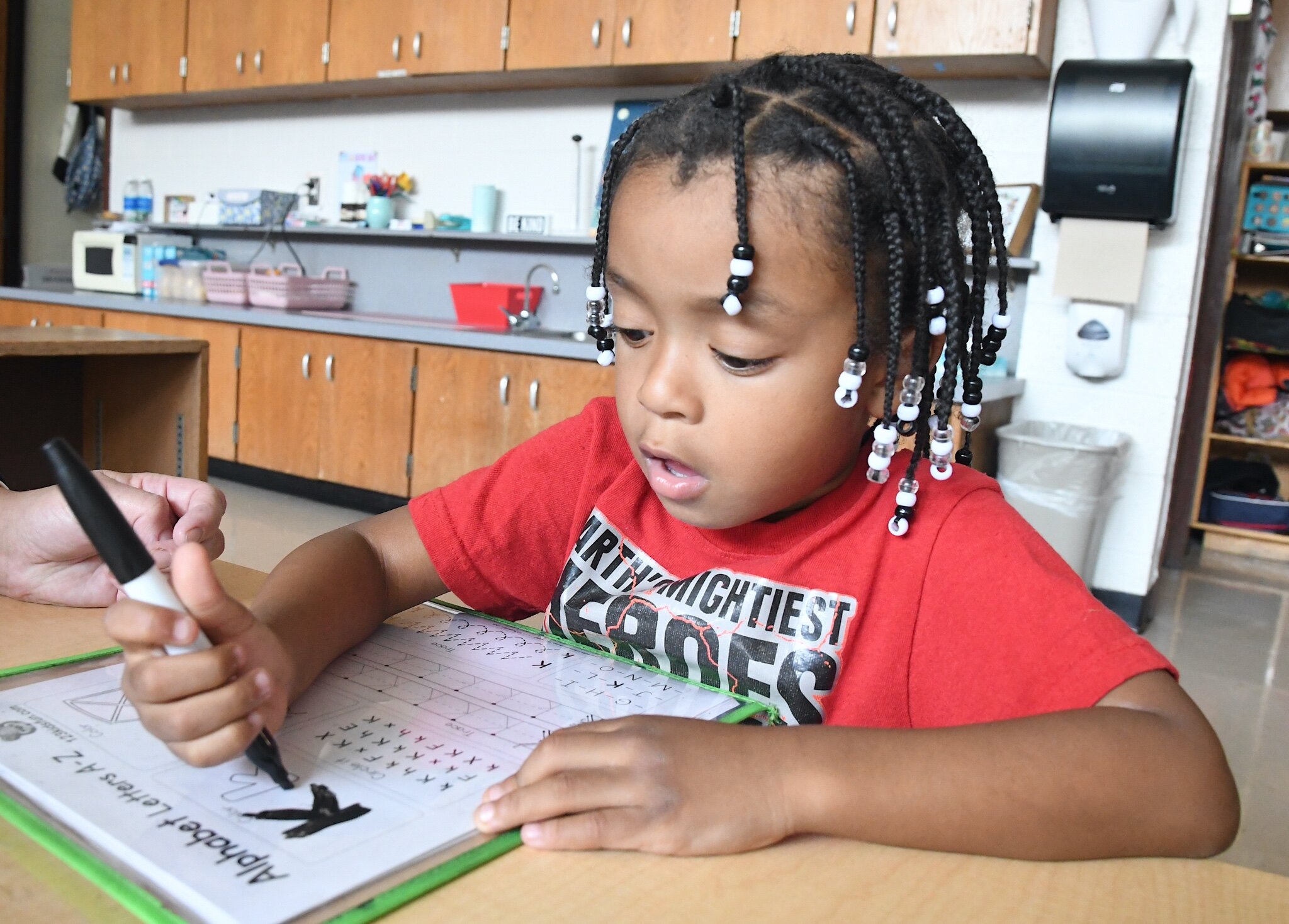 Jordin Smith practices his writing during a morning session at Franklin-Post Elementary School.