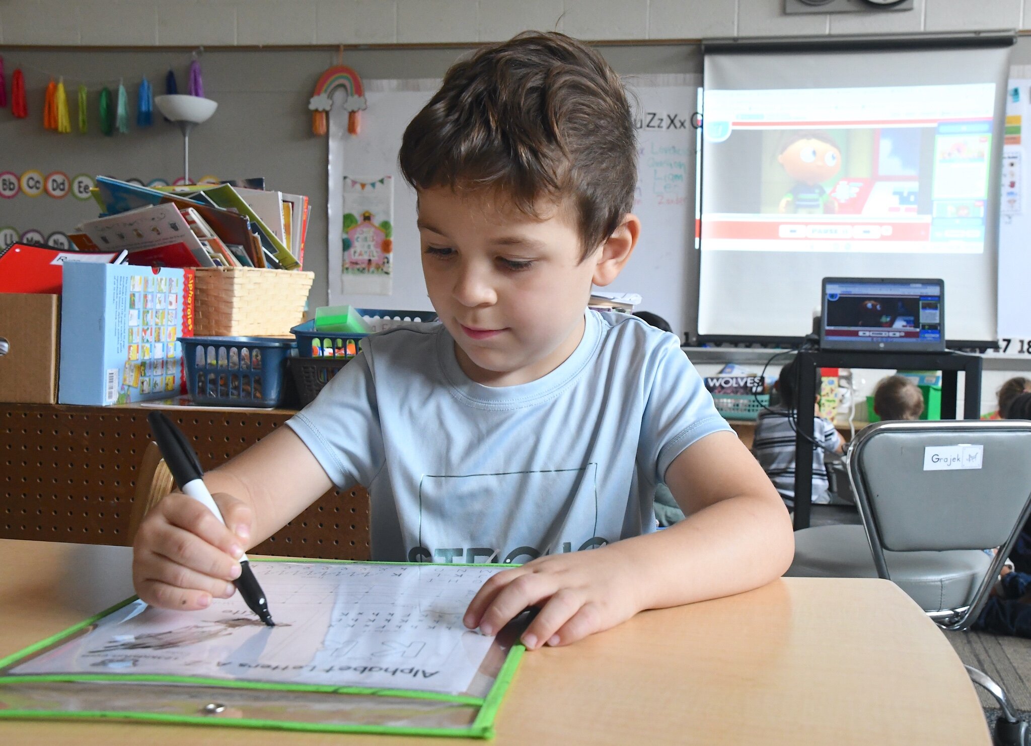 Leo Rodriguez practices his writing during a morning session at Franklin-Post Elementary School.