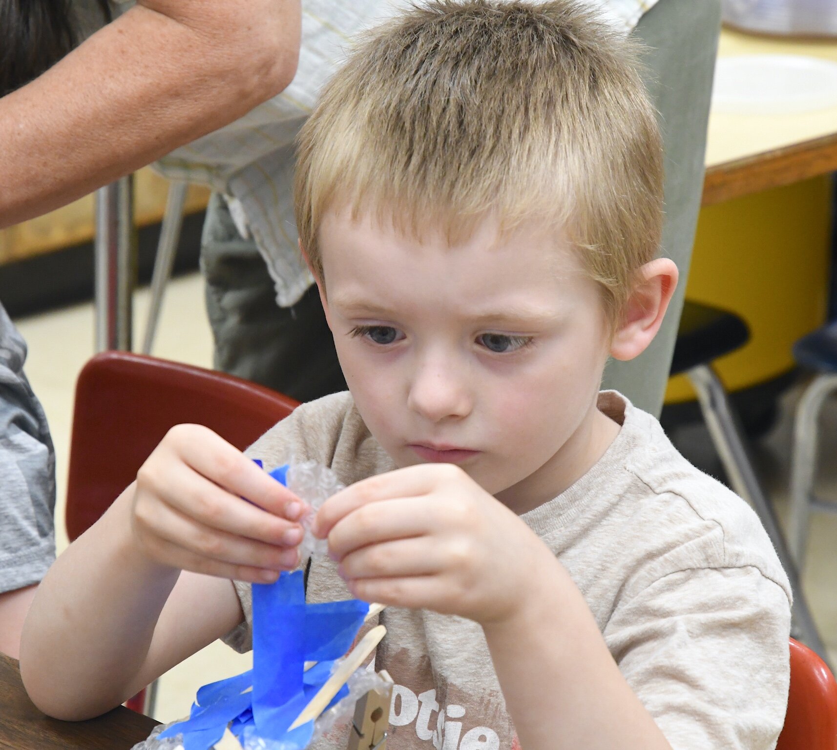 Hayden Thurman works on his boart during a morning session at Franklin-Post Elementary School.