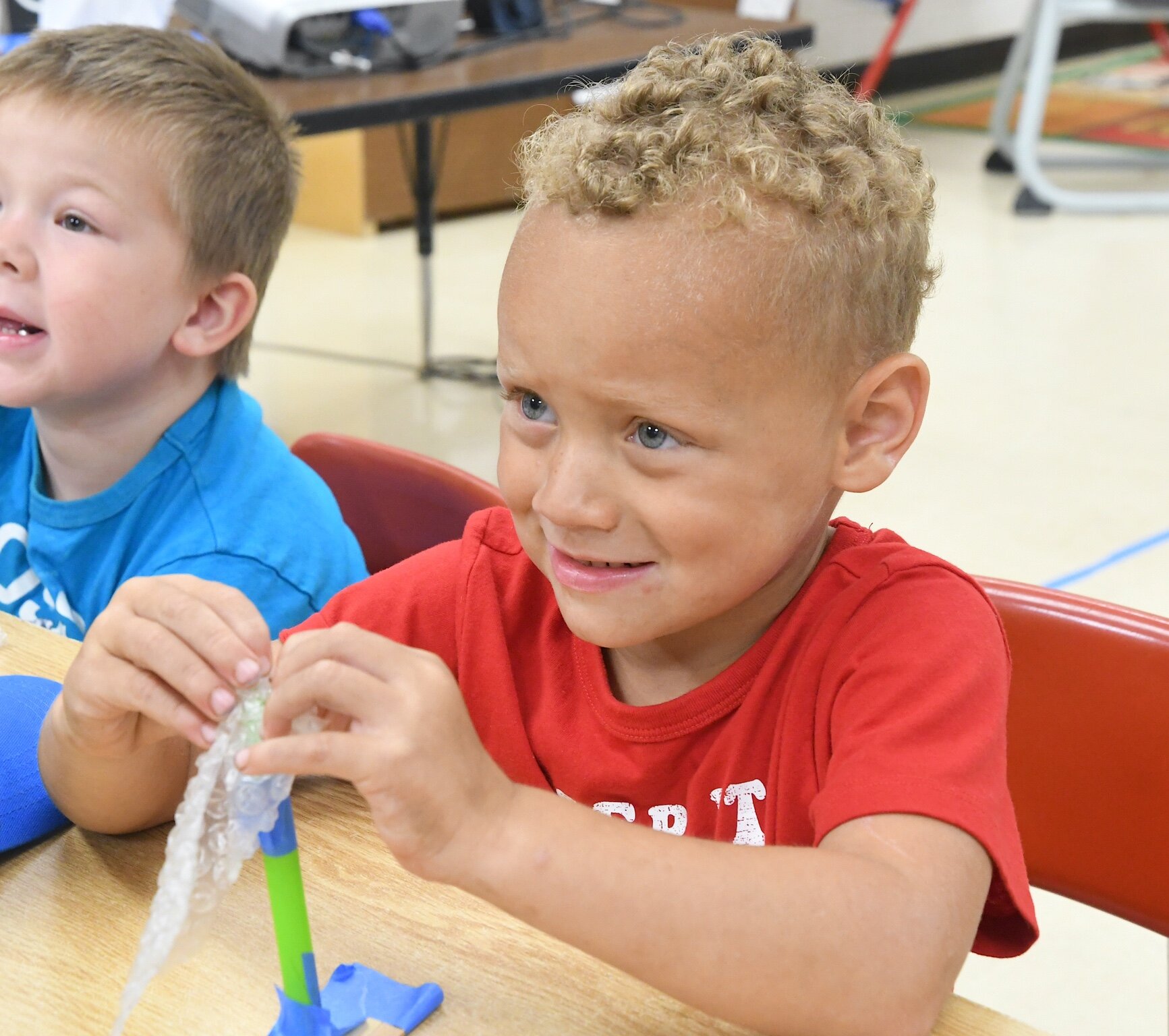 Spencer Miller, partially seen on the left, and Jayden Brown are seen with their boats during a morning session at Franklin-Post Elementary School.