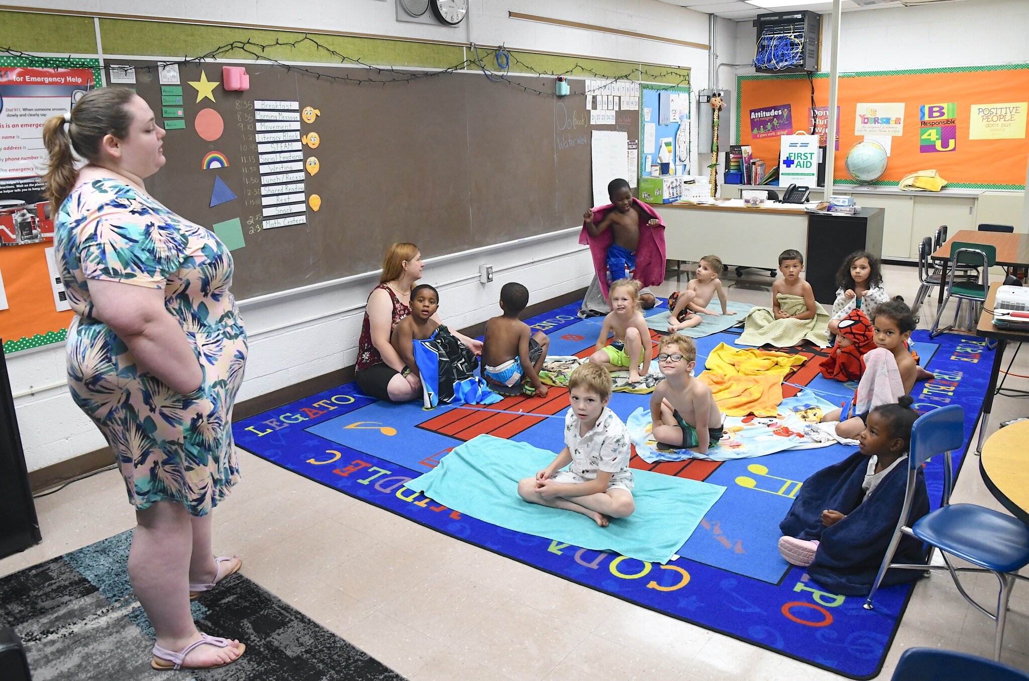 Ardenia Kamen, left, talks with students about water safety during a morning session at Franklin-Post Elementary School.