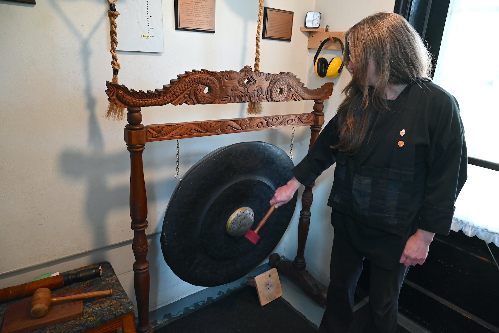 Mozuku hits a gong while issuing a call to forms at the SokukoJi Buddhist Temple Monastery in Battle Creek.