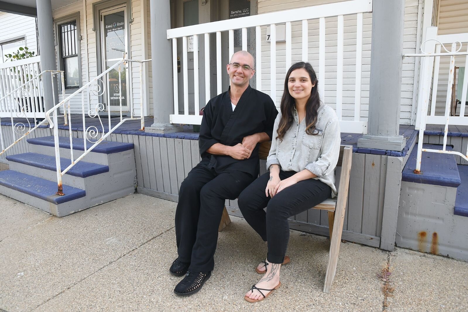 Tomczyk Chiezan and Kelley Climie sit in front of Karma House at Sokukoji Buddhist Temple Monastery