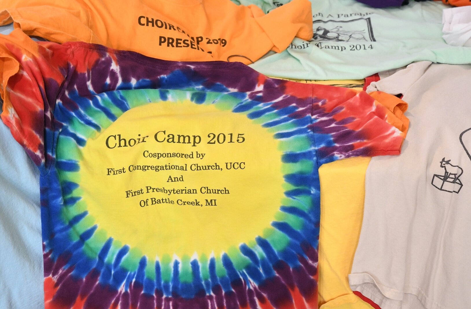 A small sampling of the T-shirts representing past choir camps.