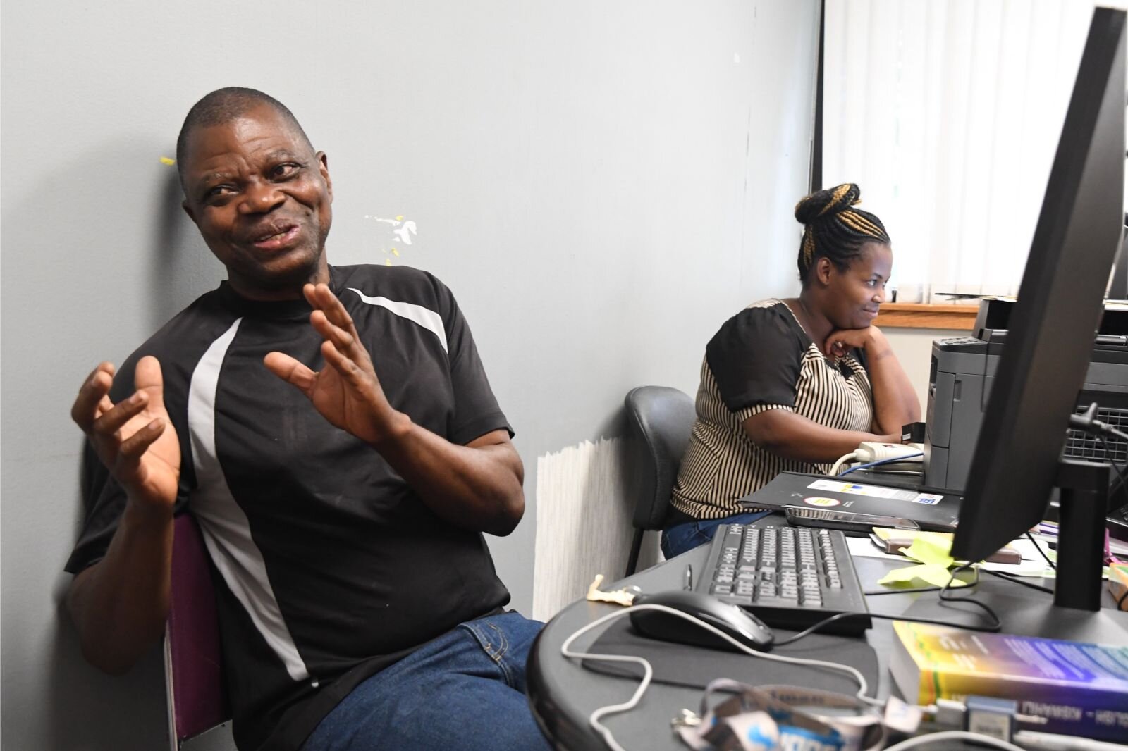 Mbuto Kabumba, left, and Roda Juma, both originally from the Congo, sit in the office at the Urban League used by members of the Uwezo Swahili Community.