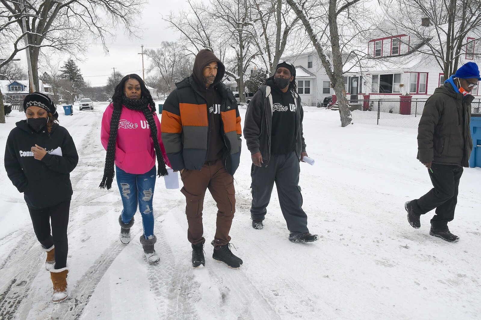 Canvassers for RISE walking down Bowen Street in Washington Heights are, from left, Deborah Crawford, Nakisha Newton, Damon Brown, Jermaihn Williams, and Richard Smith.