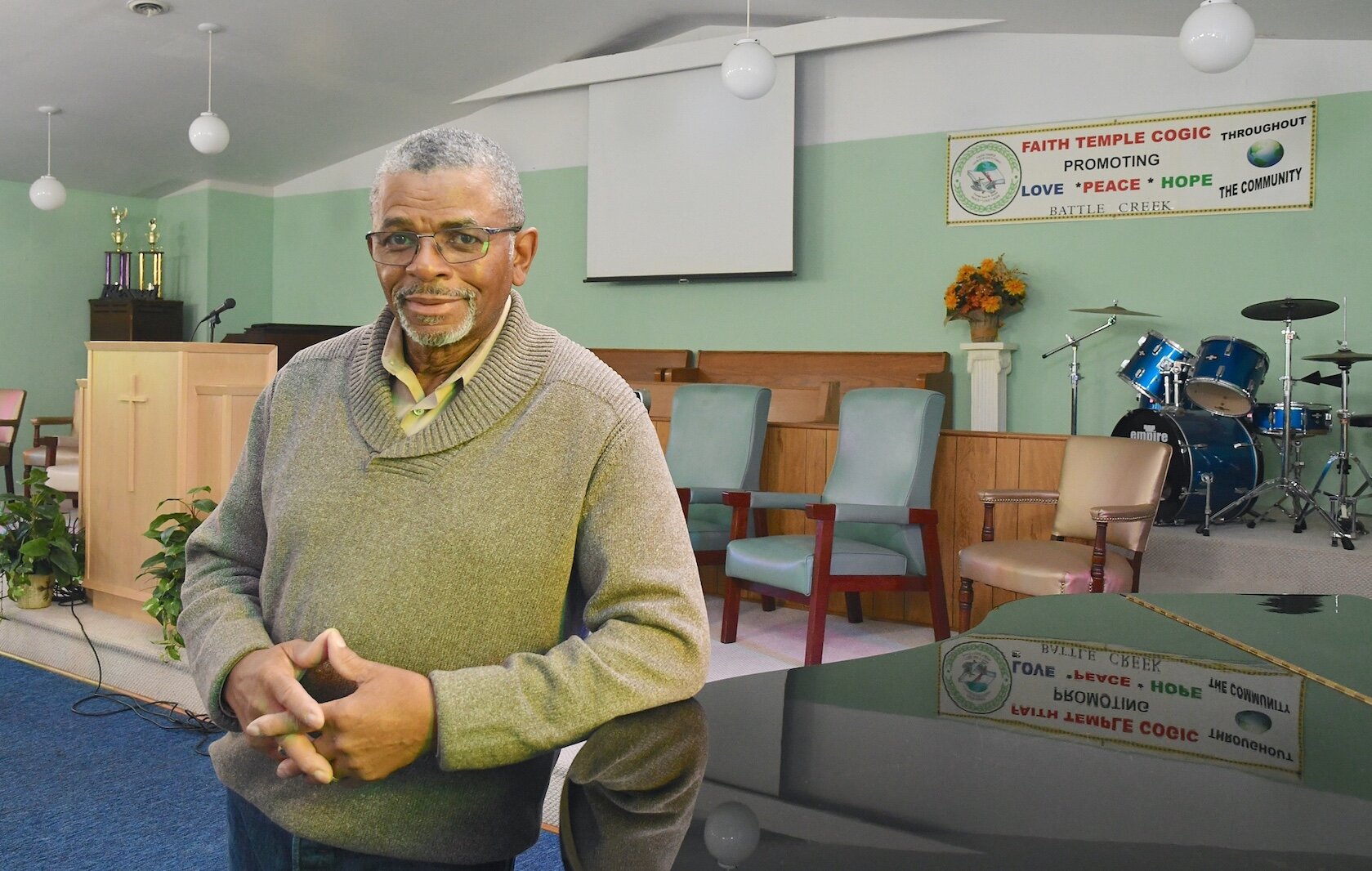 Pastor Joe Hooper stands inside Faith Temple Church of God in Christ on North Washingon Avenue.