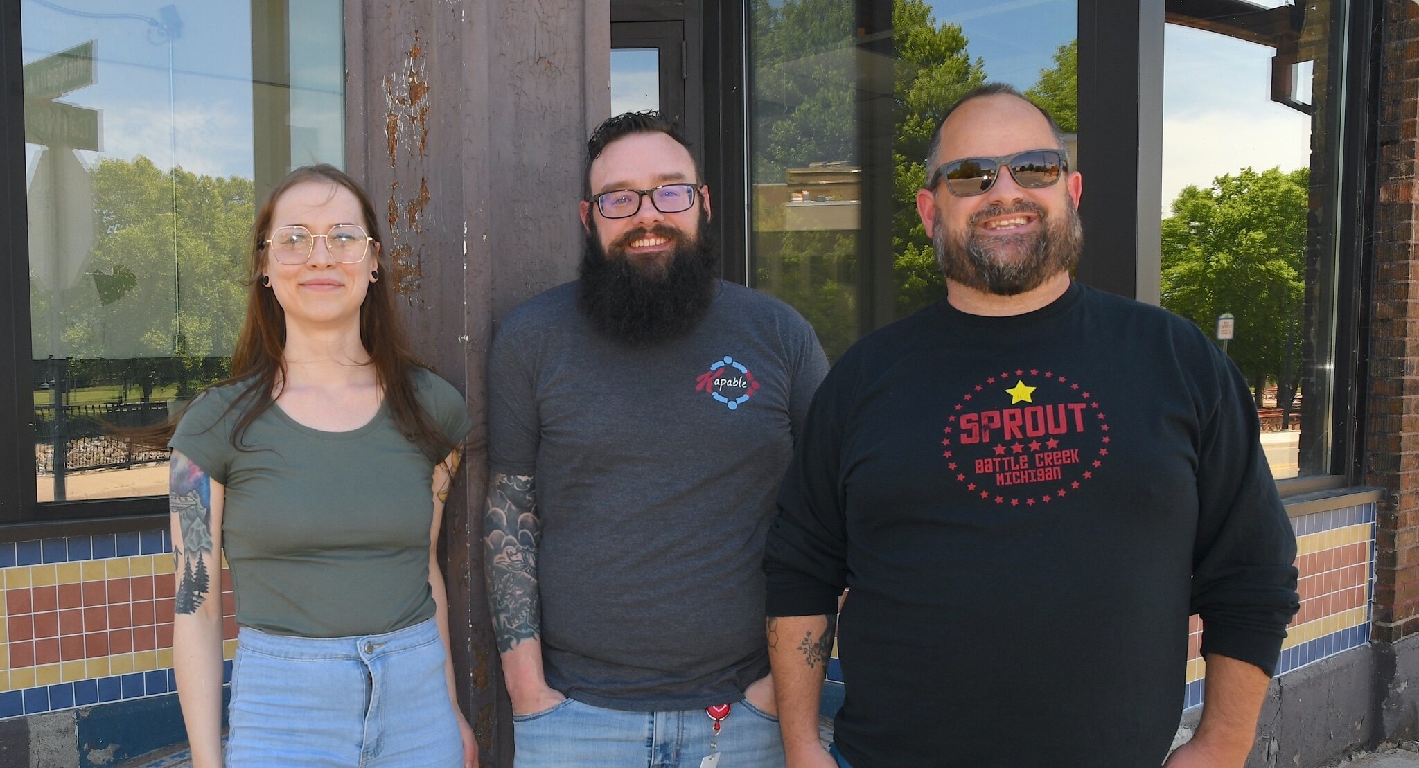 Standing in front of the future location of a local food co-op are, from left, Sprout board member Rachel Ostrander, Sprout board president Jared Kirtley, and Sprout Chief Excitement Officer Jeremy Andrews.