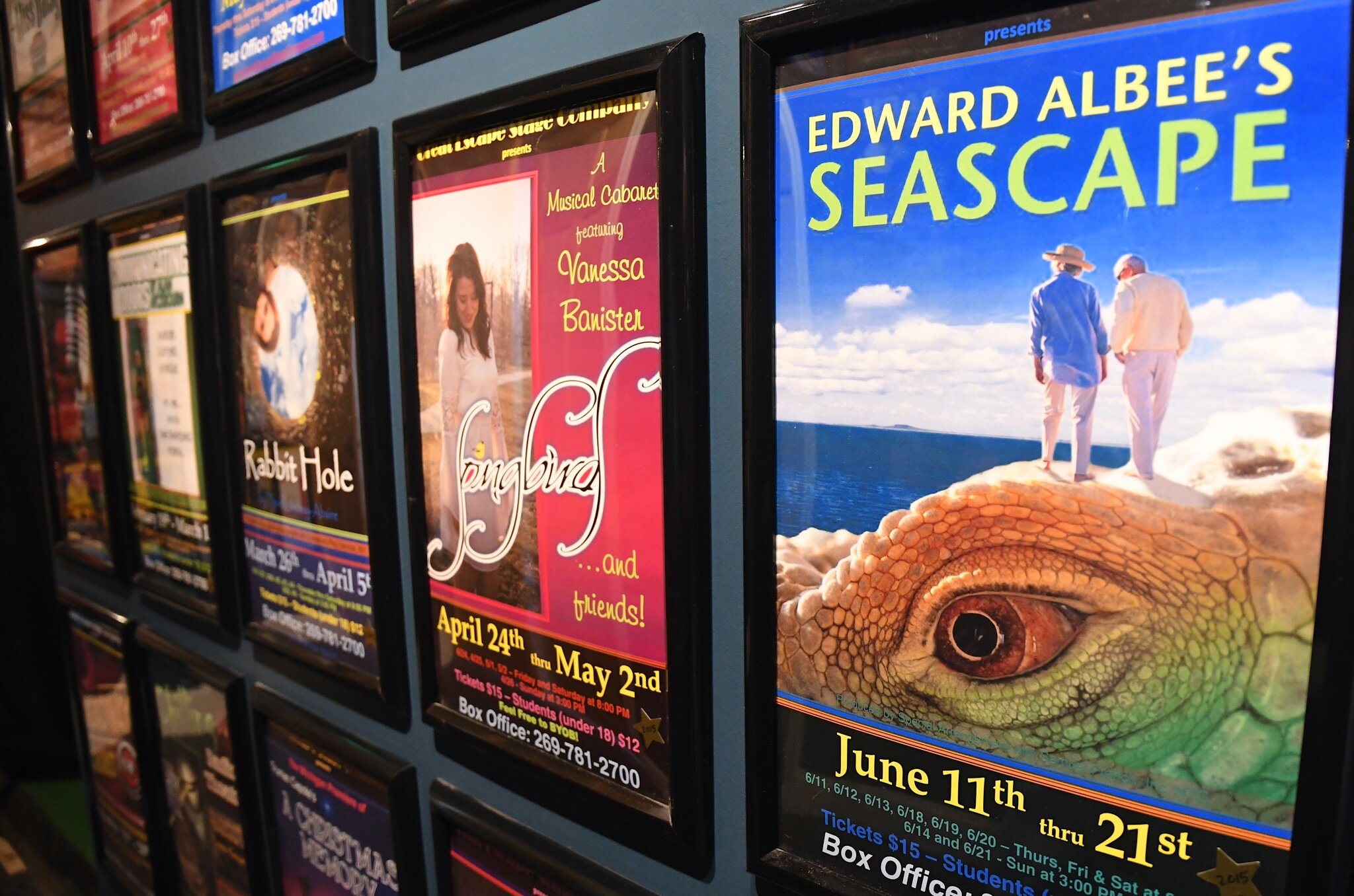 Playbills of past productions line the walls of the lobby at the Great Escape Stage Company.