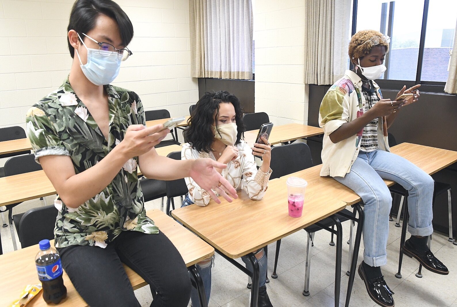 Western Michigan University students rehearsing for an upcoming performance of “Guys and Dolls” with the Battle Creek Symphony Orchestra are, from left, Henry Lee, Isabella Abuan, and Travon Moore.