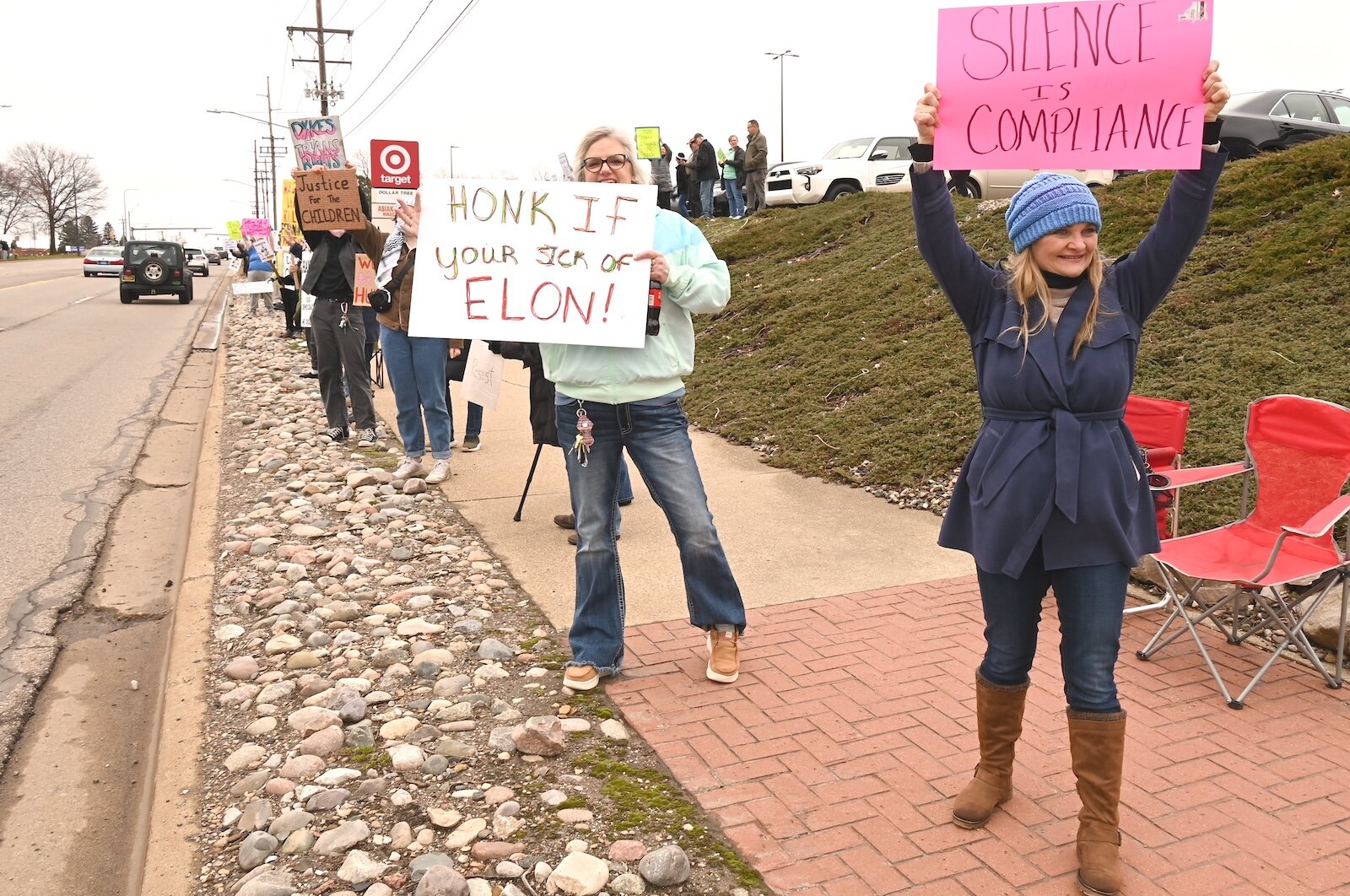 Alisha Carr, right, and others participate in the April 5 Hands Off demonstration on Beckley Road in Battle Creek.
