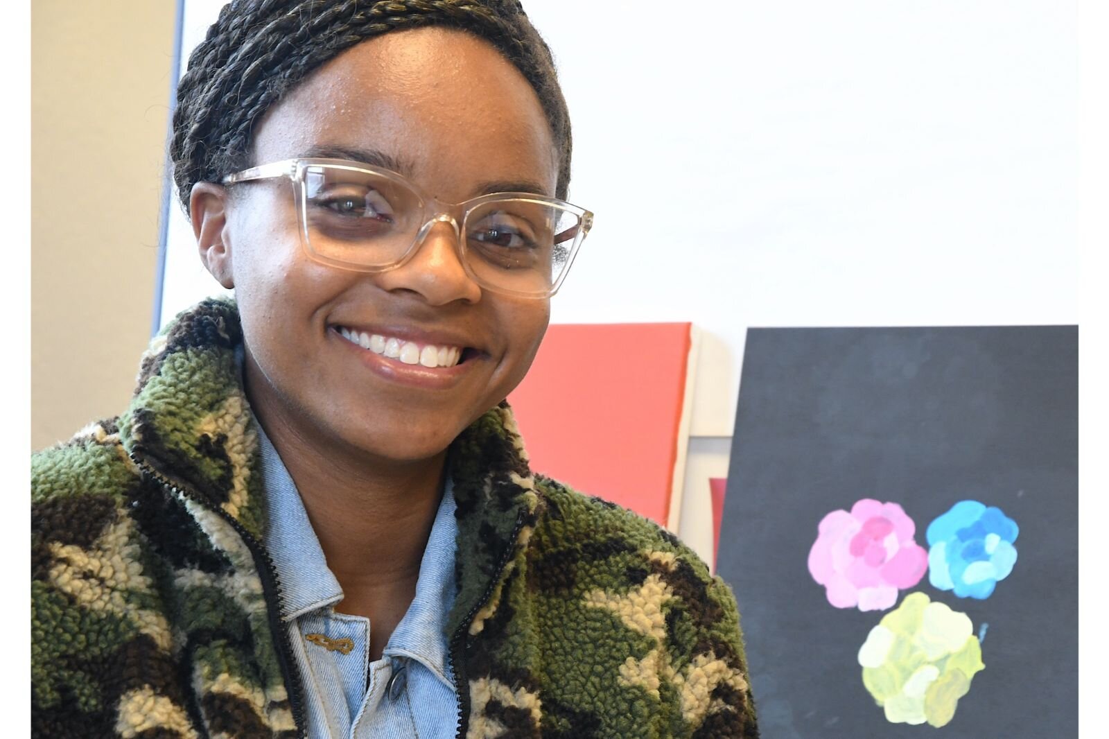 Jamari Taylor, artist and art instructor, sits in a studio inside First Congregational Church in downtown Battle Creek.