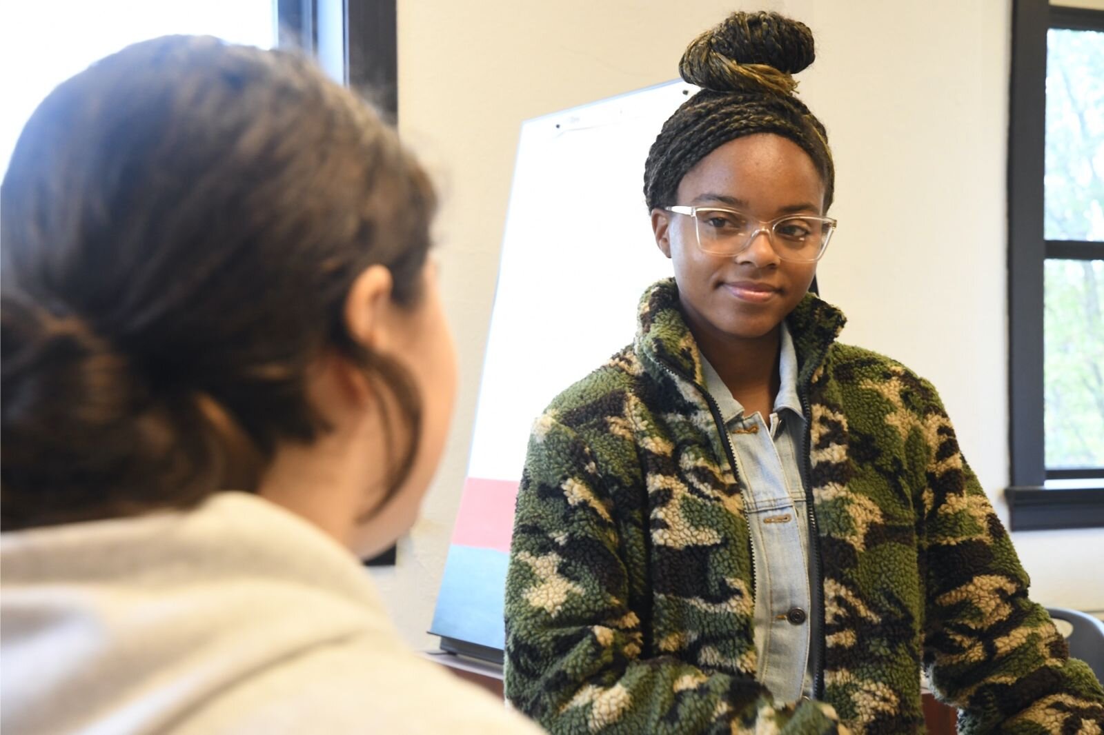 Jamari Taylor, right, provides feedback to one of her students, Willow Schantz.