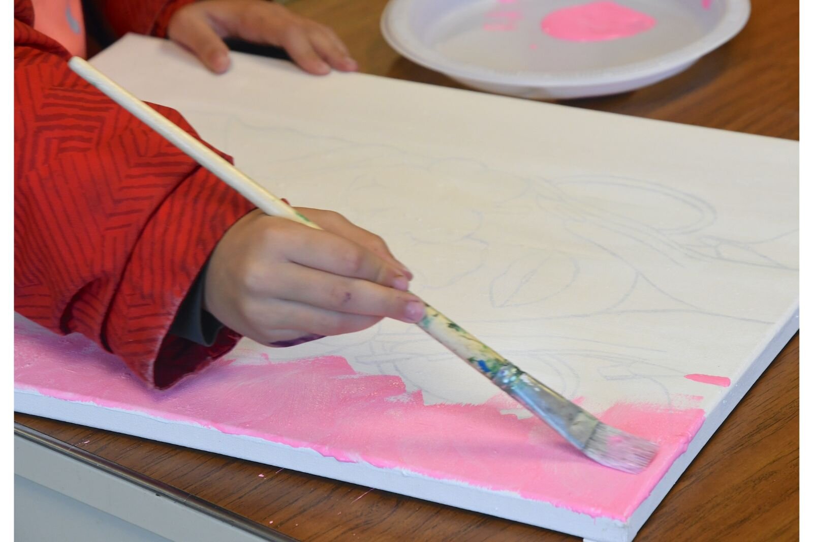 Cora Vance works on a painting