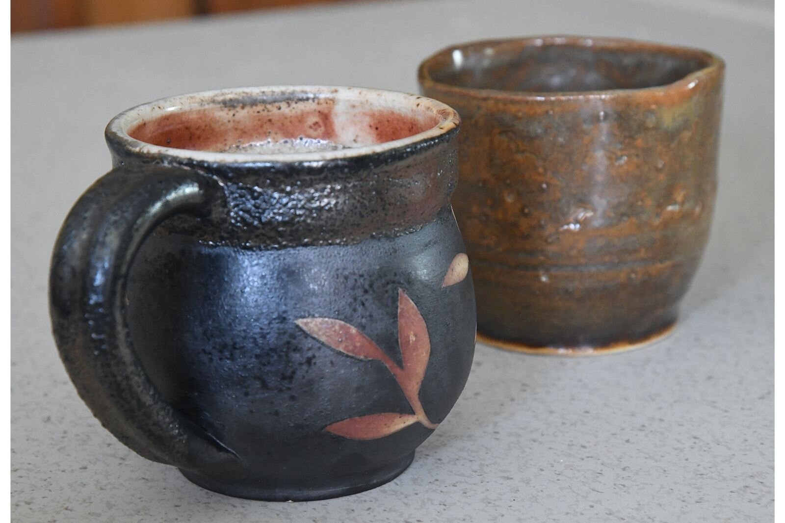 One of Laura’s favorite pieces, a cup, sits to the left of her very first creation.