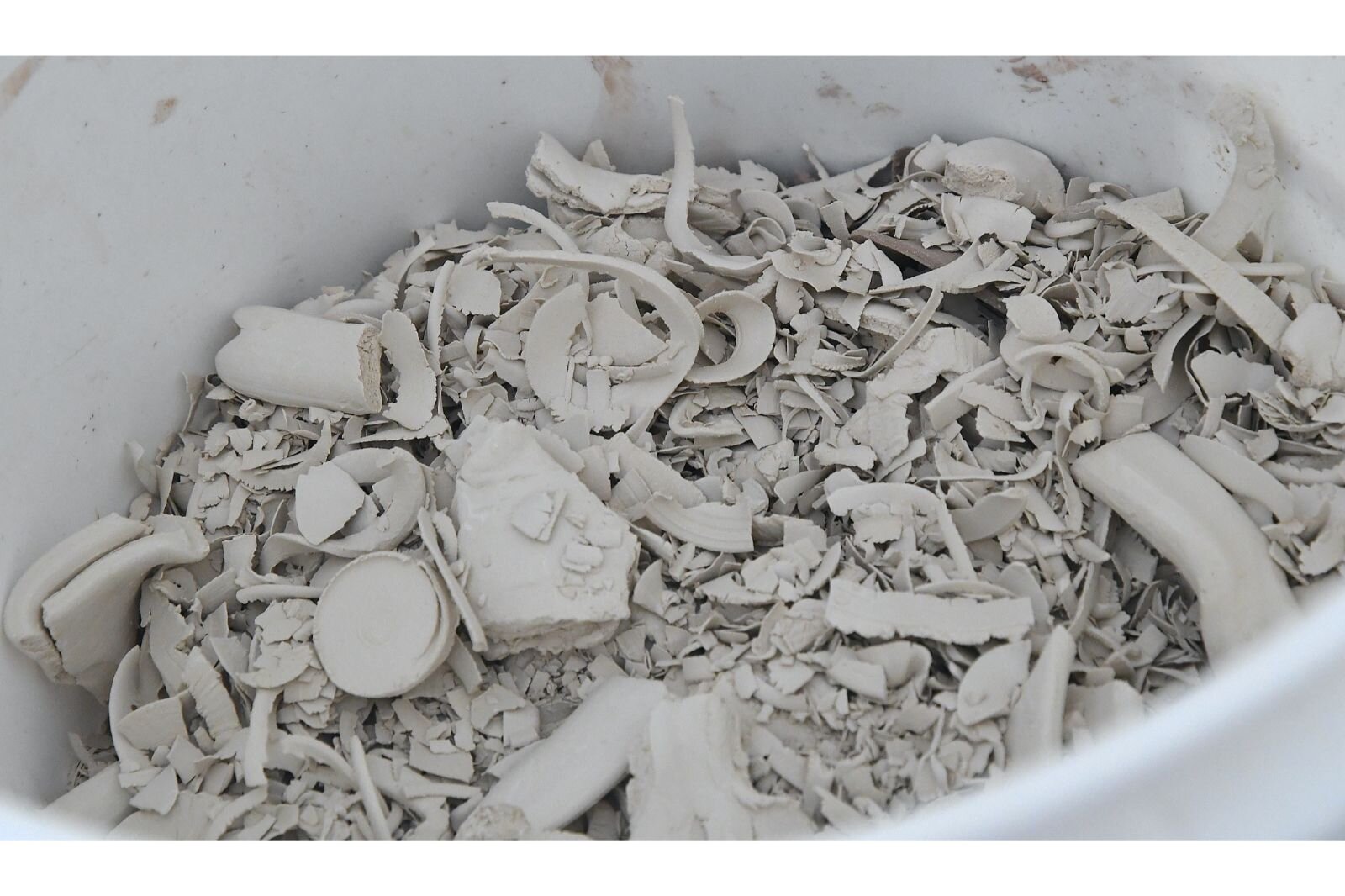 Laura keeps scraps of clay which she will later re-use.