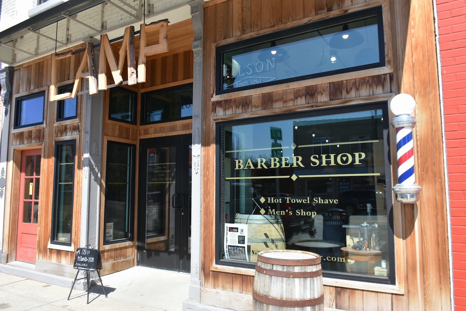 Sign over the entrance to the Camp barbershop in downtown Marshall.