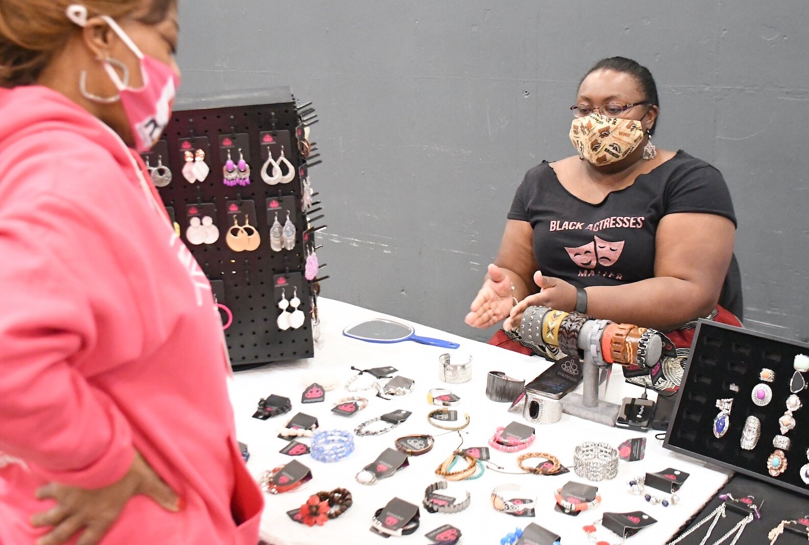 Deborah Crawford, left, talks with Altamiece C. (Ballard) Cooper, owner of Broadway Bling, at Monday’s “We, Us, Our: 55 Shades of Black” commemoration of Martin Luther King, Jr’s birthday in Battle Creek.