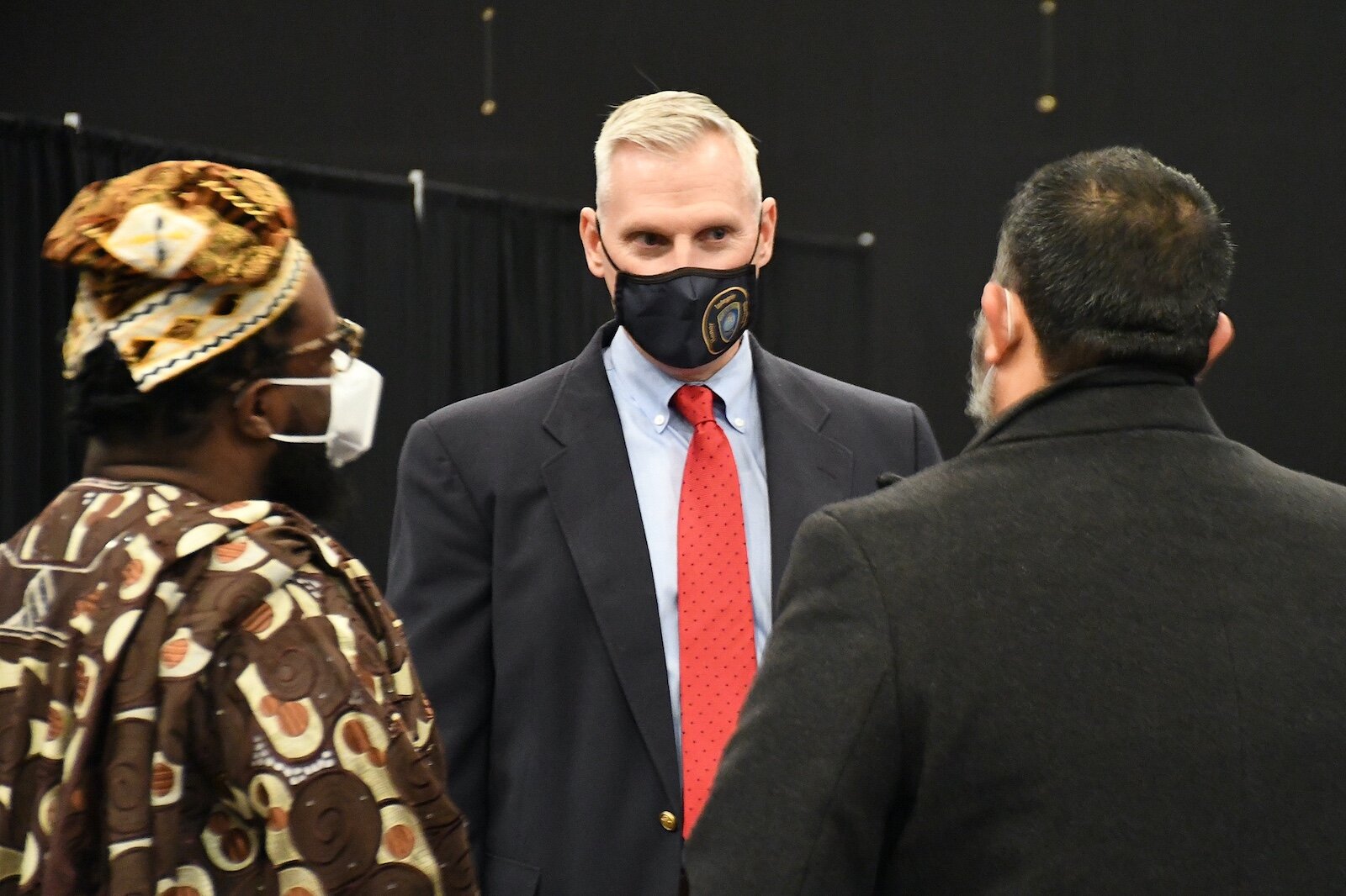 Battle Creek Chief of Police Jim Blocker talks with two attendees at Monday’s “We, Us, Our: 55 Shades of Black” commemoration of Martin Luther King, Jr’s birthday.