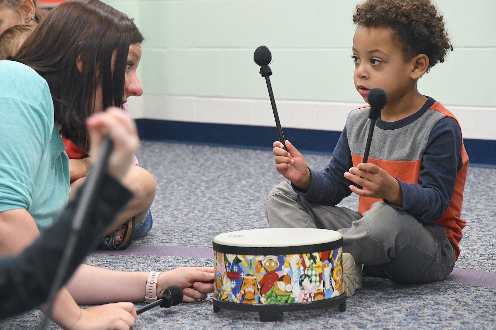Malik Alexander, 4, and Teri Noaeill, instructor, play together during a Music First session at the Music Center.