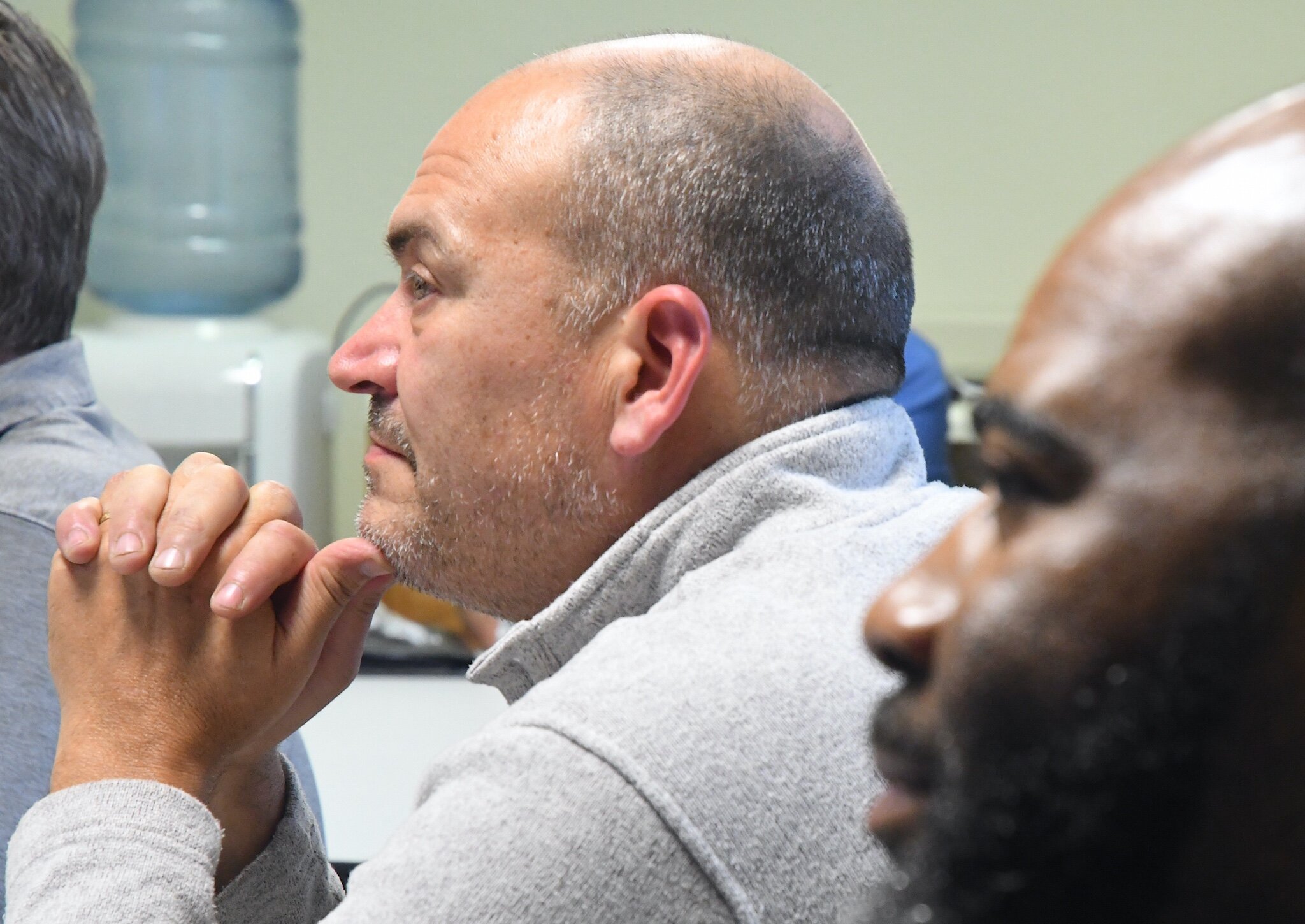 Dave Owens, left, a Marine Corps veteran from Delton, and Sean Stallwork, an Air Force veteran from Battle Creek, listen to presenters during the opening session of the Michigan Veteran Entrepreneur Lab session in Battle Creek.