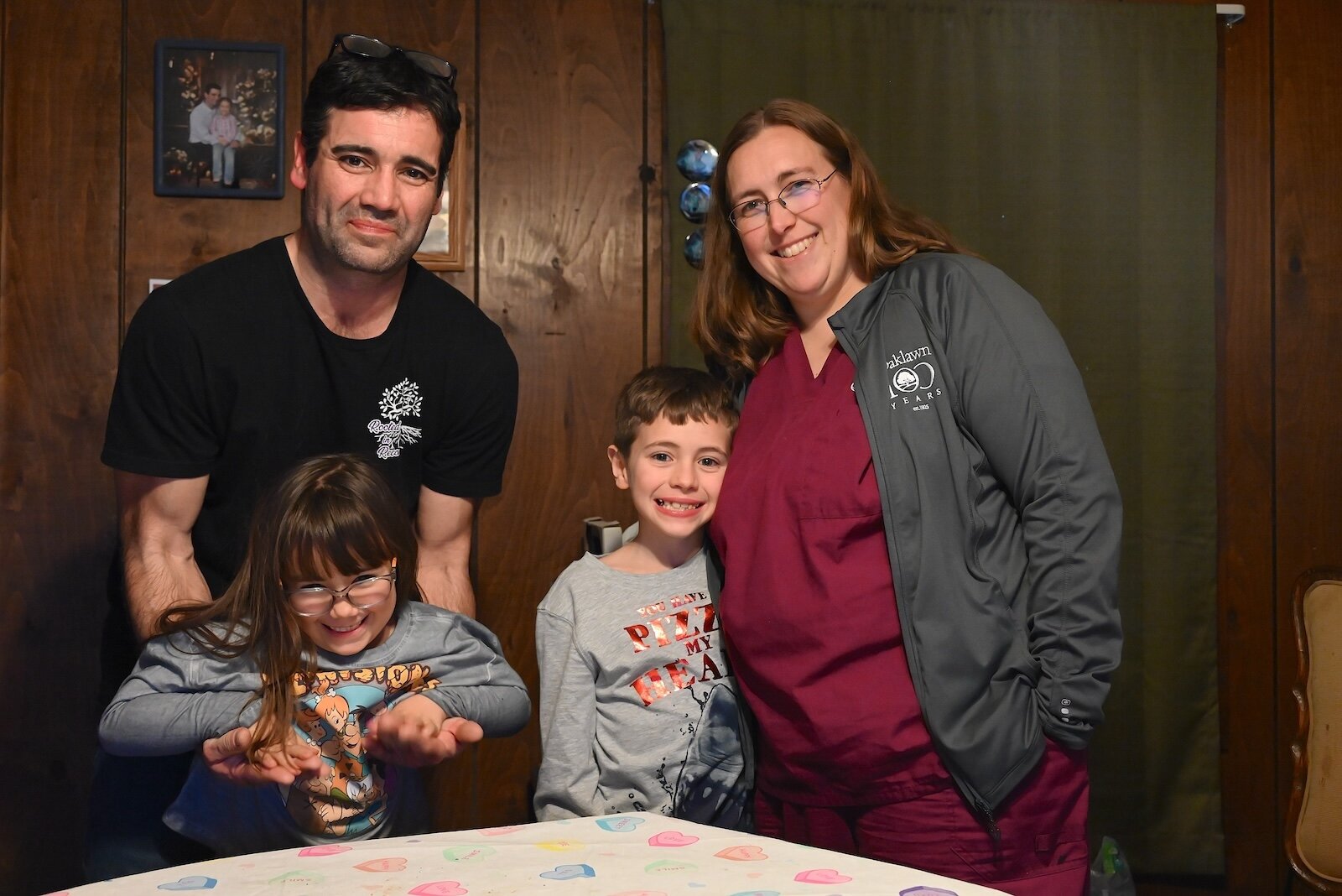 Seen in their family’s home in Marshall are, from left, Greg Ramos with daughter Serenity, and Briette Ramos, with son Skyler.