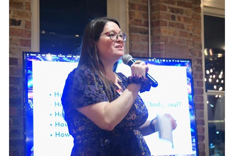 Rosemary Linares, co-coordinator of the Battle Creek Coalition for Truth, Racial Healing, and Transformation, addresses attendees of the Envisioning Dinner on the National Day of Racial Healing, January 16, at The Record Box in downtown Battle Creek.