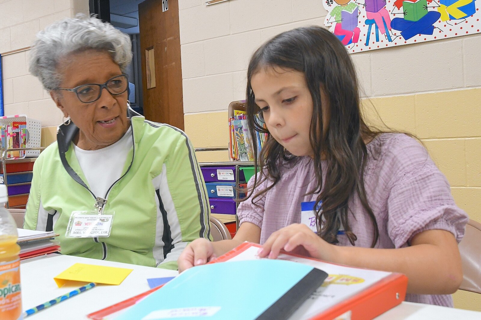 Thelma Vaughn, left, works with Bianca Howard, 8, at Second Missionary Baptist’s after-school tutoring program.