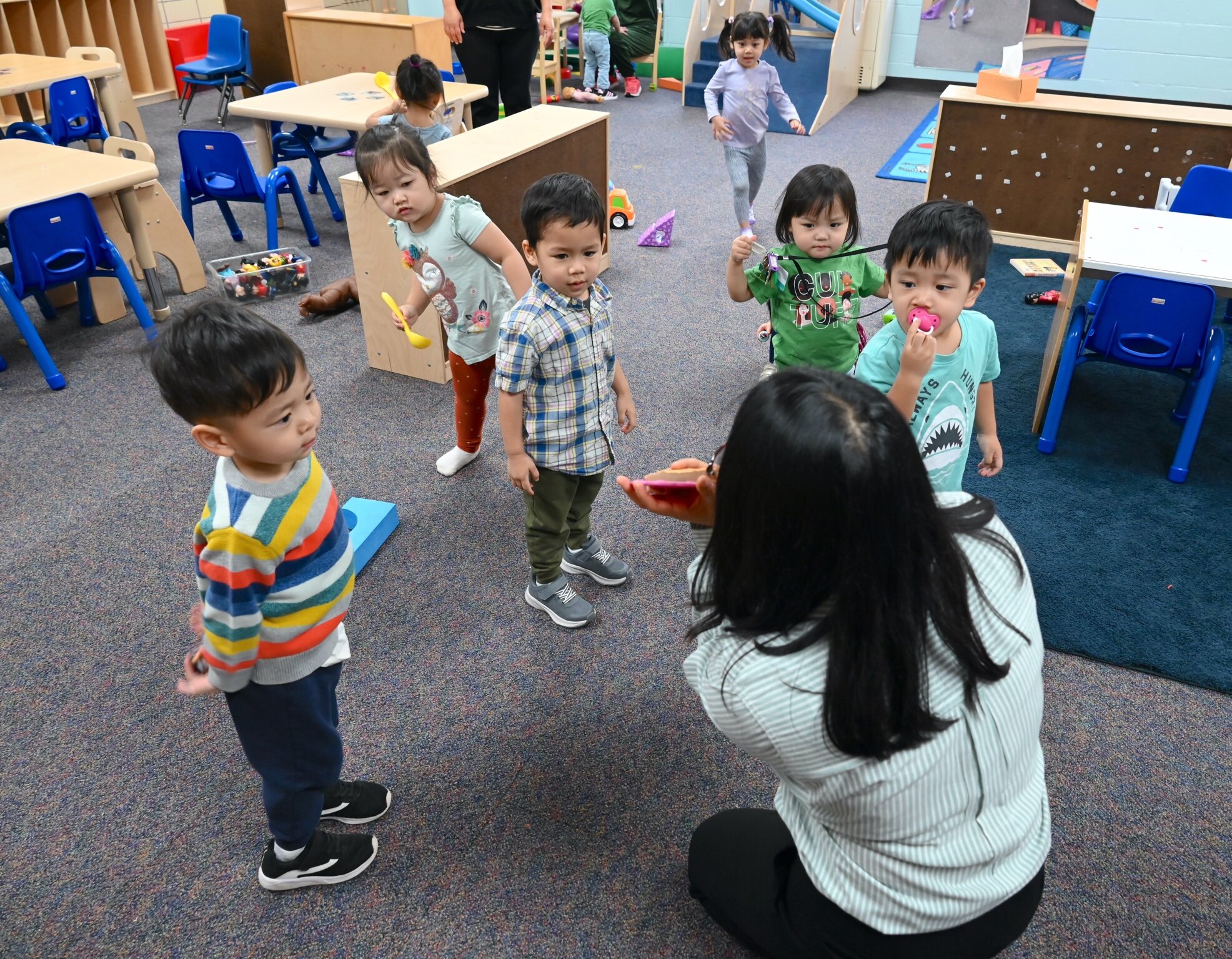 Helen Pau has the attention of a group of young children at the Burma Center’s Dream Learning Center.