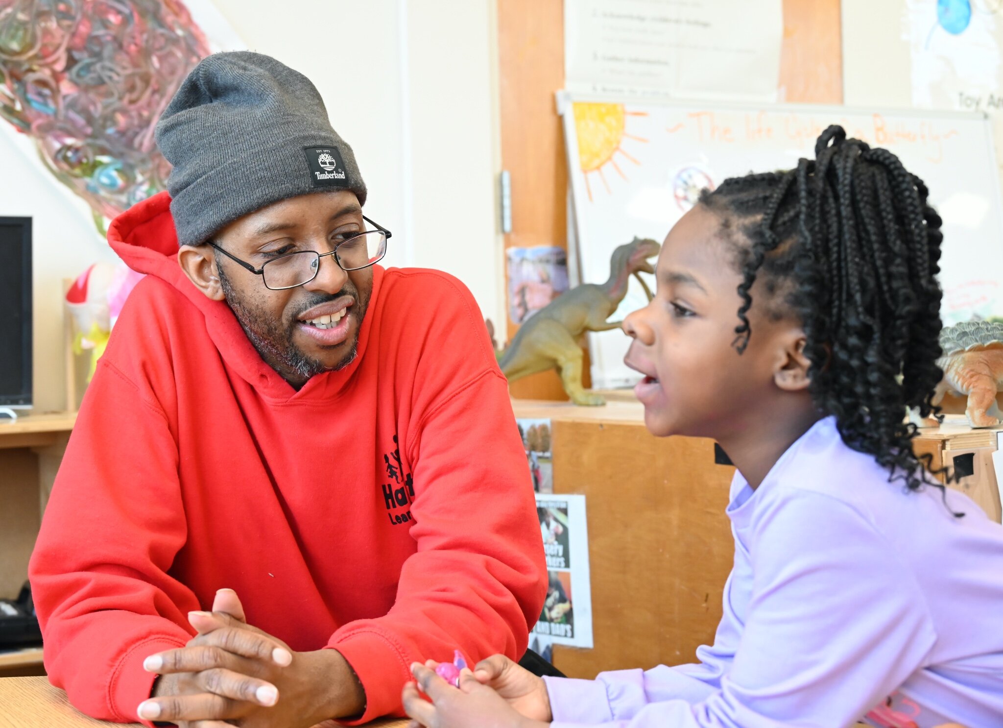 Craig Buchanan works with a young child at New Harvest Christian’s Learning Center.