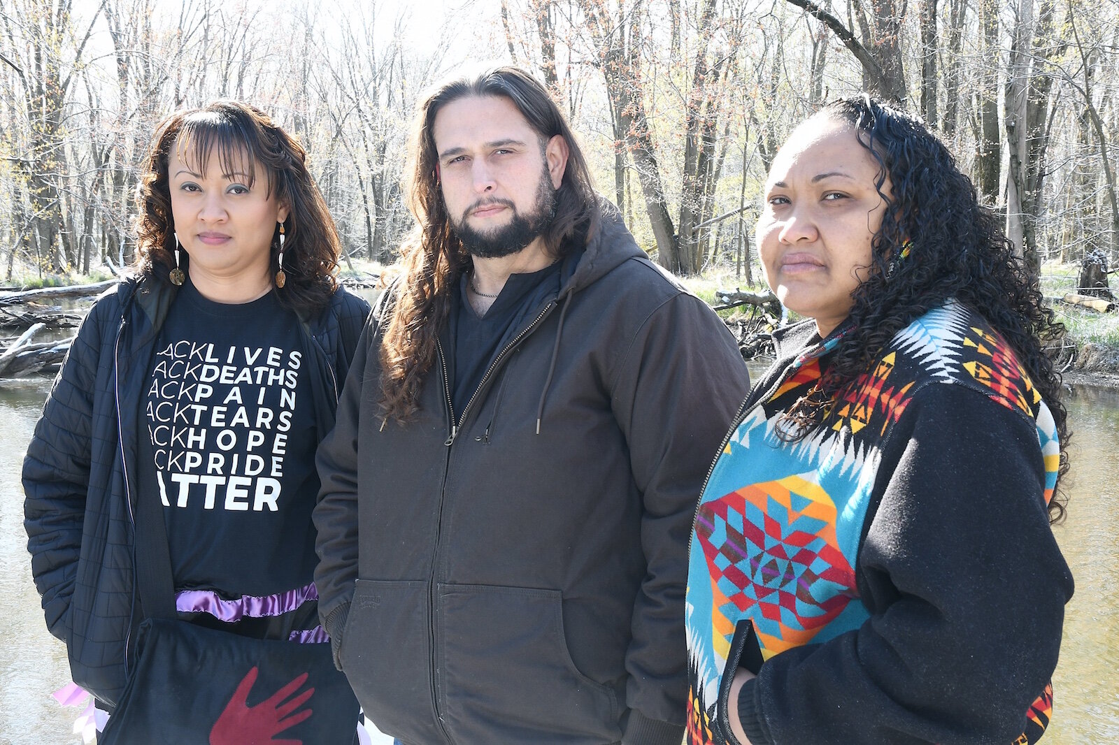 Mariesha Keith, Fred Jacko, and Nickole Keith stand near the arena used during powwows at the Nottawaseppi Huron Band of Potawatomi’s Pine Creek Indian Reservation.